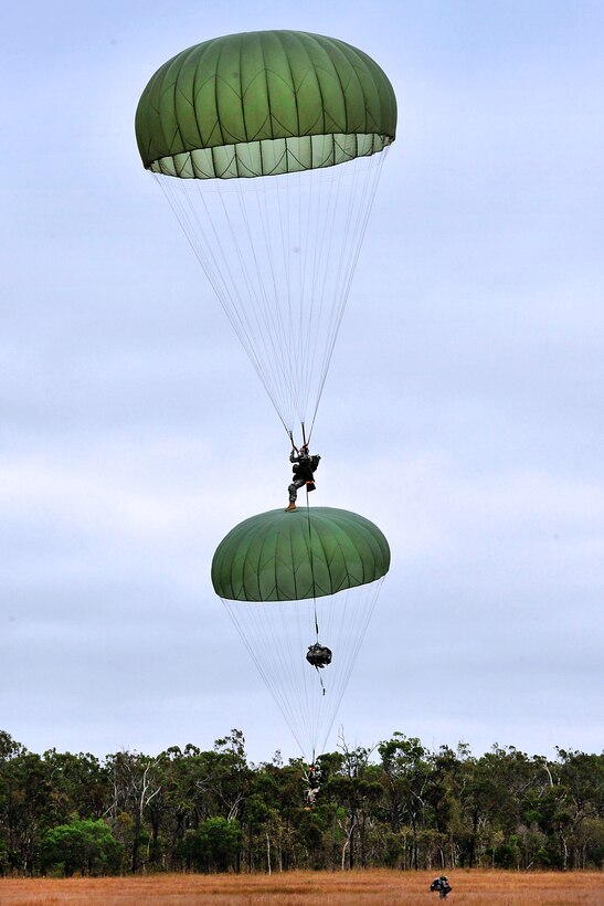 U.S. Army soldiers parachute into Drop Zone Kapyong at Shoalwater Bay training area in Queensland, Australia, July 17, 2011.