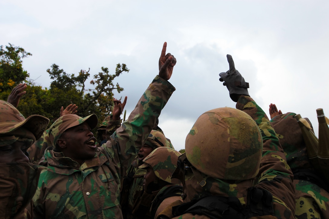 South African National Defense Force soldiers sing ahead of a joint U.S.-South African simulated assault on July 26 as part of Exercise Shared Accord 2011. SA ‘11 is a bi-lateral military training and civil assistance mission held annually throughout Africa. (U.S. Marine Corps photo by Cpl. Jad Sleiman)