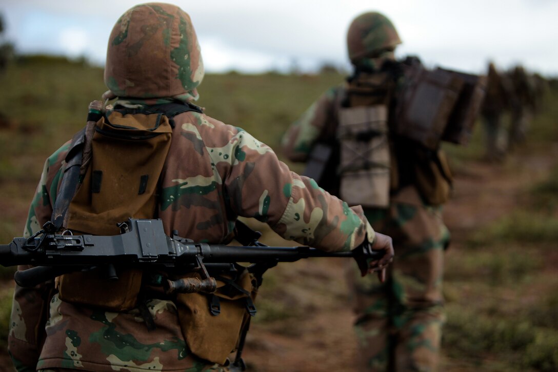 South African National Defense Force soldiers hike back up a hill during a joint U.S.-South African simulated assault on July 26 as part of Exercise Shared Accord 2011. SA ‘11 is a bi-lateral military training and civil assistance mission held annually throughout Africa. (U.S. Marine Corps photo by Cpl. Jad Sleiman)