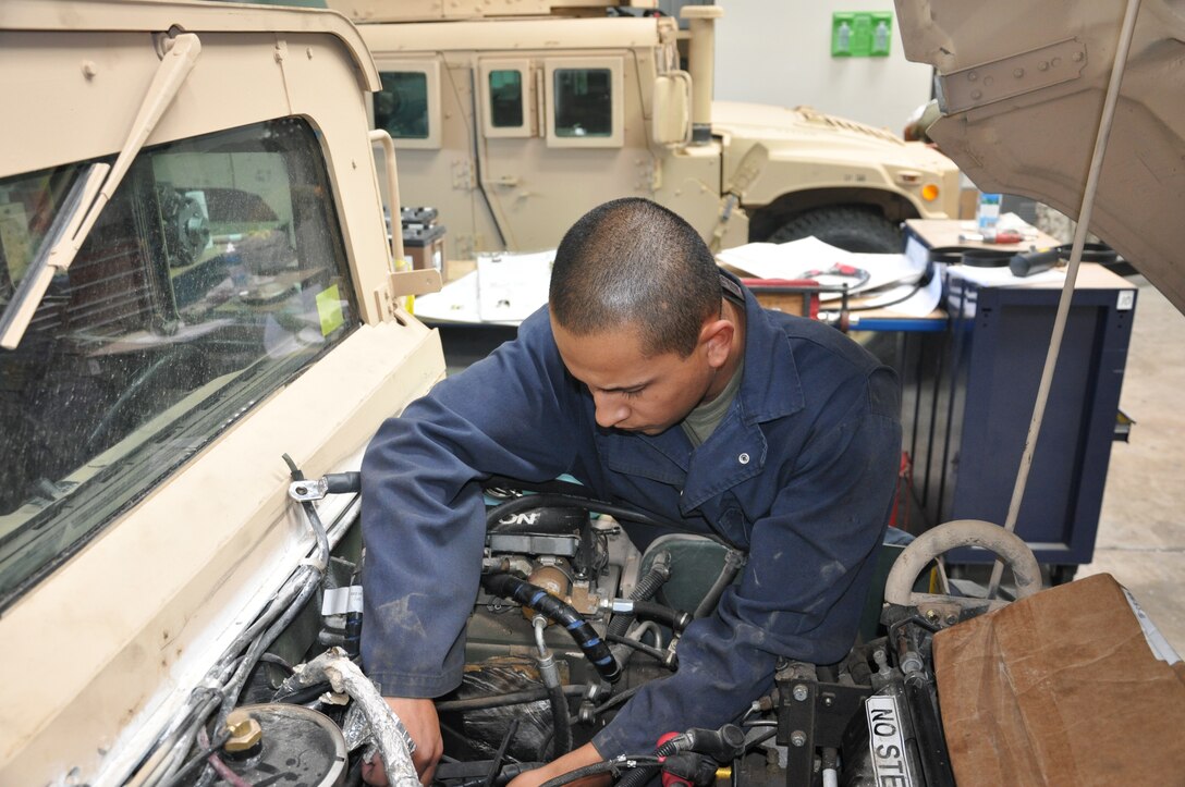 Corporal Miguel Verdin, a 21-year-old heavy mobile equipment mechanic from Aurora, Ore., preps an M1114 Humvee prior into installing a new alternator July 26 at the Strip 8 facility aboard the Yermo Annex of Marine Corps Logistics Base Barstow.