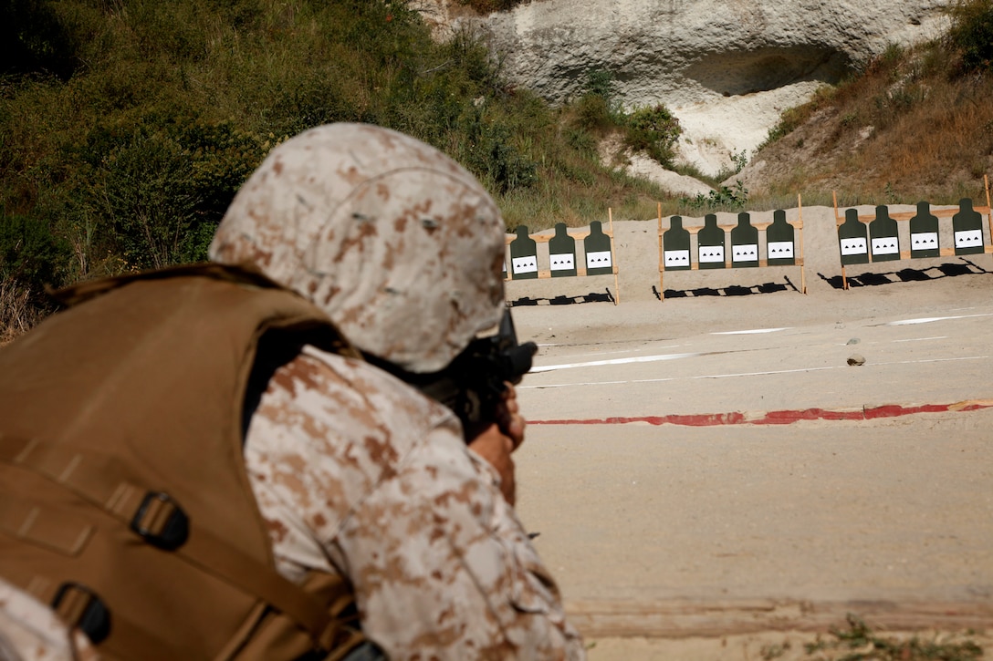 A Marine with the 15th Marine Expeditionary Unit Command Element adjusts his battle-sight zero, as a part of a familiarization fire range conducted on Camp Pendleton, July 26-27.