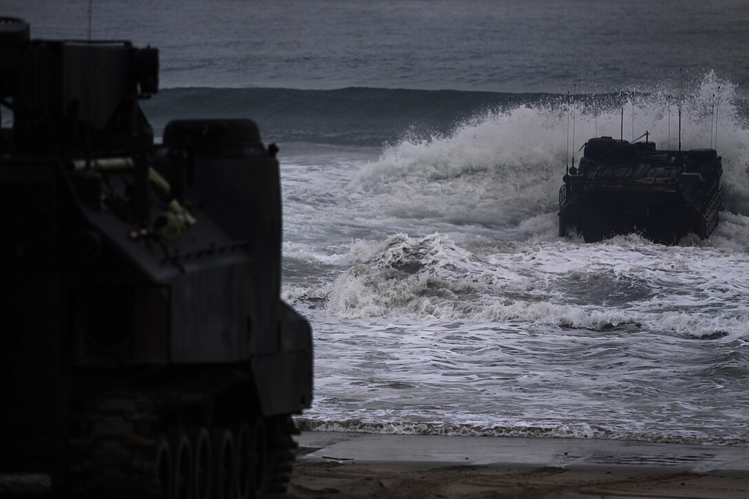 An Amphibious Assault Vehicle splashes into the shoreline of Camp Pendleton’s Red Beach as part of a training exercise, July 26. More than 550 Marines from 4th Assault Amphibian Battalion reserve unit came to base as part of their annual training exercises to practice amphibious assault tactics.