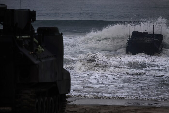 An Amphibious Assault Vehicle splashes into the shoreline of Camp Pendleton’s Red Beach as part of a training exercise, July 26. More than 550 Marines from 4th Assault Amphibian Battalion reserve unit came to base as part of their annual training exercises to practice amphibious assault tactics.