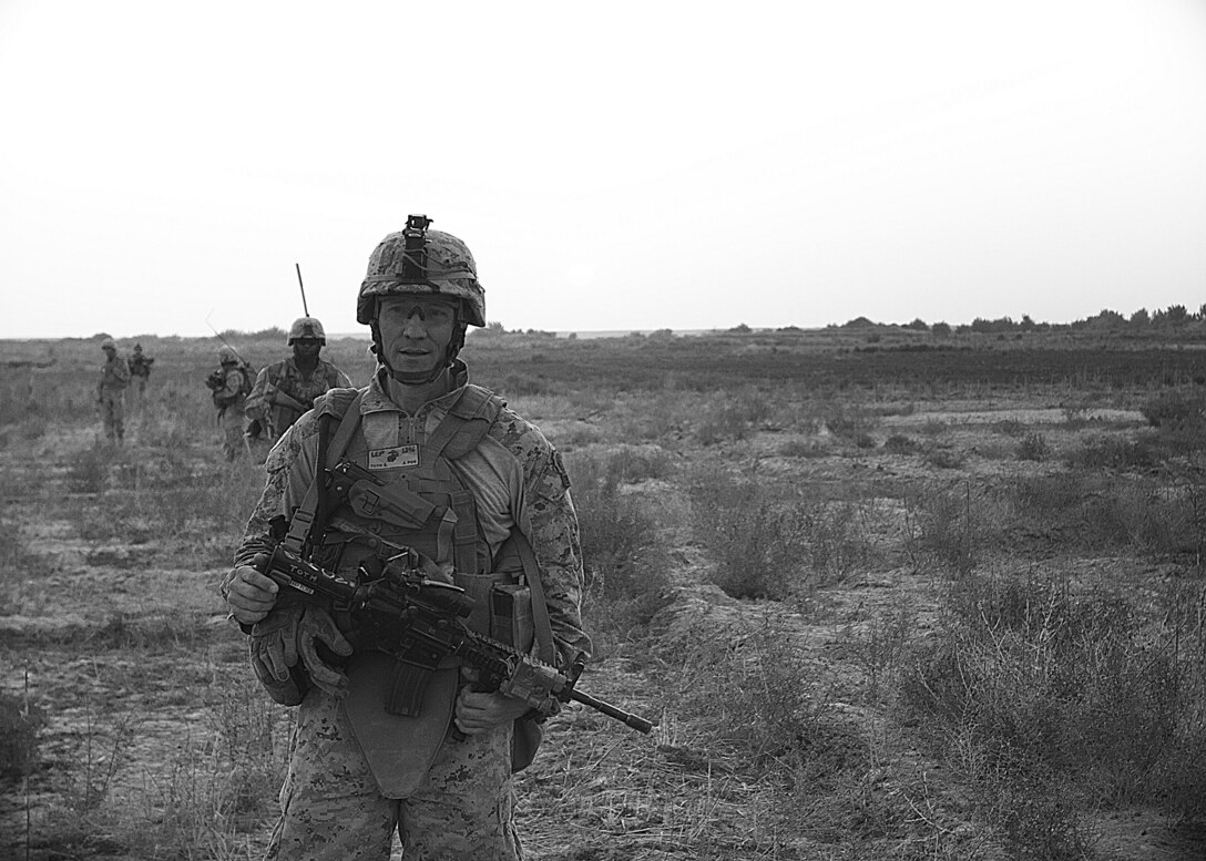 A Marine with 2nd Battalion, 6th Marine Regiment, 2nd Marine Division, sights in on some argets down range while participating in a live fire exercise July 27, 2011 aboard Marine Corps Base Camp Lejeune, N.C.. During the exercise, Marines with machine guns laid suppressive fire while other Marines with M-16’s and M-4’s moved closer to engage their respective targets.
