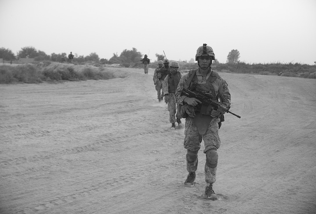 A Marine with 2nd Battalion, 6th Marine Regiment, 2nd Marine Division, sights in on some argets down range while participating in a live fire exercise July 27, 2011 aboard Marine Corps Base Camp Lejeune, N.C.. During the exercise, Marines with machine guns laid suppressive fire while other Marines with M-16’s and M-4’s moved closer to engage their respective targets.