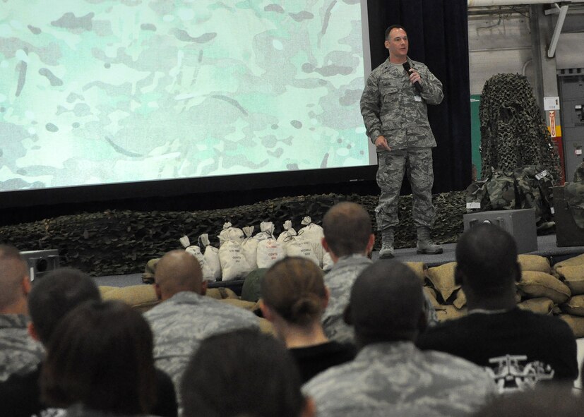 Lt. Col. Christopher Abate, Financial Management competition commander, briefs the Financial Management Rodeo teams on the previous days’ scores during the morning Pump-Up as part of the Air Mobility Rodeo competition July 27, 2011, at Joint Base Lewis-McChord, Wash. The Pump-Up occurs every morning of Rodeo and consists of introductions and scores from the previous day. Rodeo is a bi-annual competition that encompasses all aspects of Air Mobility Command, including aerial port, aeromedical evacuation, maintenance, security forces, and financial management. (U.S. Air Force photo/Airman 1st Class Leah Young)