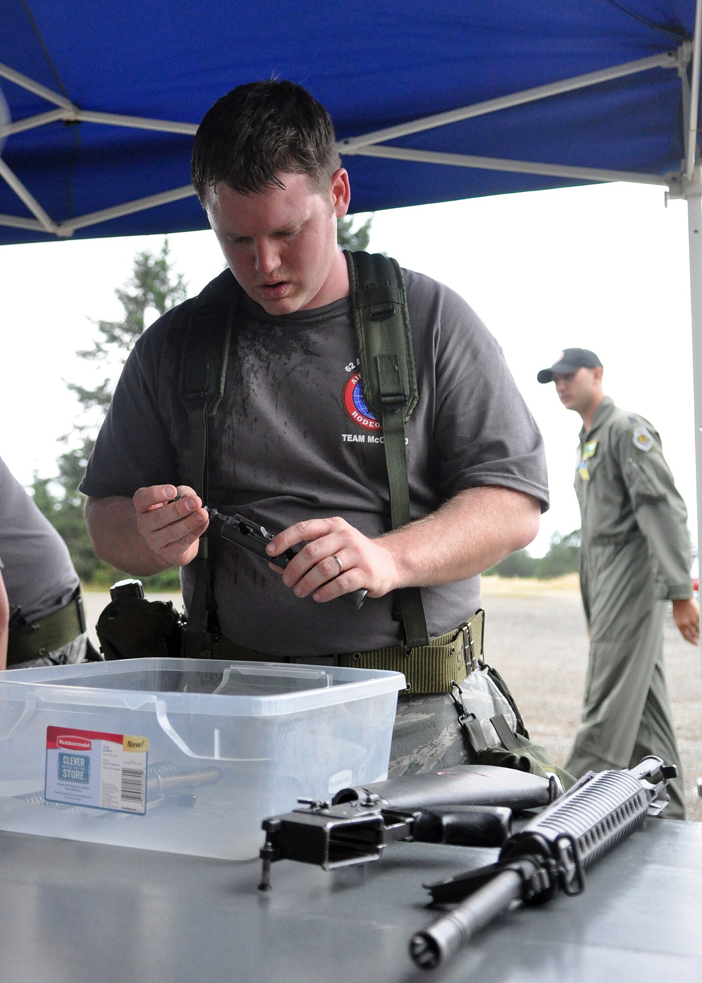 Senior Airman Cody Frasch, 62nd Financial Management team member, assembles an M-16 during the challenge course as part of the Rodeo competition July 26, 2011, at Joint Base Lewis-McChord, Wash. Sit-ups, push-ups and a two-mile run were just a few of the skills tested during the course. Teams were also graded on small arms assembly and Airman’s Manual knowledge. Rodeo is a bi-annual competition that encompasses all aspects of Air Mobility Command, including aerial port, aeromedical evacuation, maintenance, security forces, and financial management. (U.S. Air Force photo/Airman 1st Class Leah Young) 