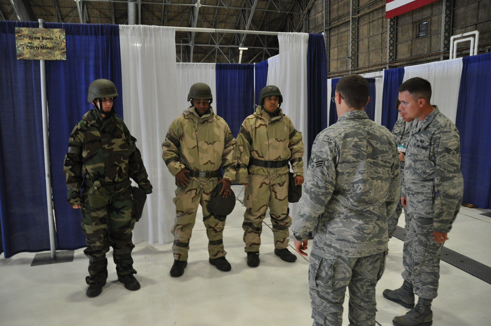 Tech. Sgt. Antonio Williams, Staff, Sgt, Jessica Wilson and Staff Sgt. Larry Roberts, all members of the 60th Comptroller Squadron, participate in the Air Mobility Rodeo 2011 financial management competition July 26, 2011 at Joint Base Lewis-McChord, Wash. (U.S. Air Force photo/Airman 1st Class Michael Battles)