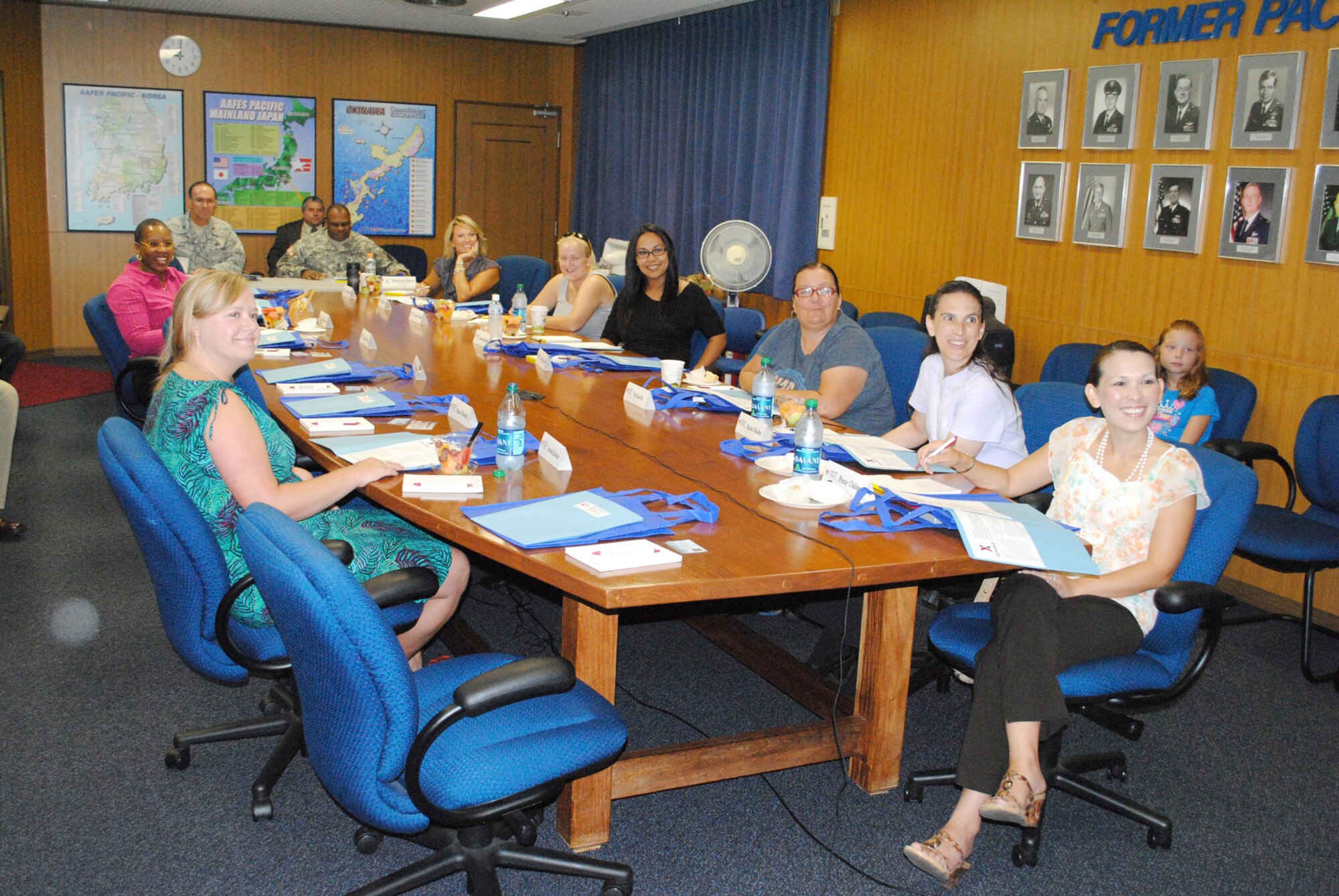 Kadena Air Base family members and senior leadership from the Exchange Pacific Region interact with personnel from the Army and Air Force Exchange Service Headquarters in Dallas via a teleconference from the Exchange Pacific Region Headquarters during the first Pacific Region Patriot Family focus group session on Camp Foster, Japan, July 22. Over the course of the meeting, family members provided feedback on exchange merchandise selection, availability and pricing, addressing their concerns and questions directly to exchange managers and leadership. (U.S. Army photo/Sgt. 1st Class Jon Cupp)