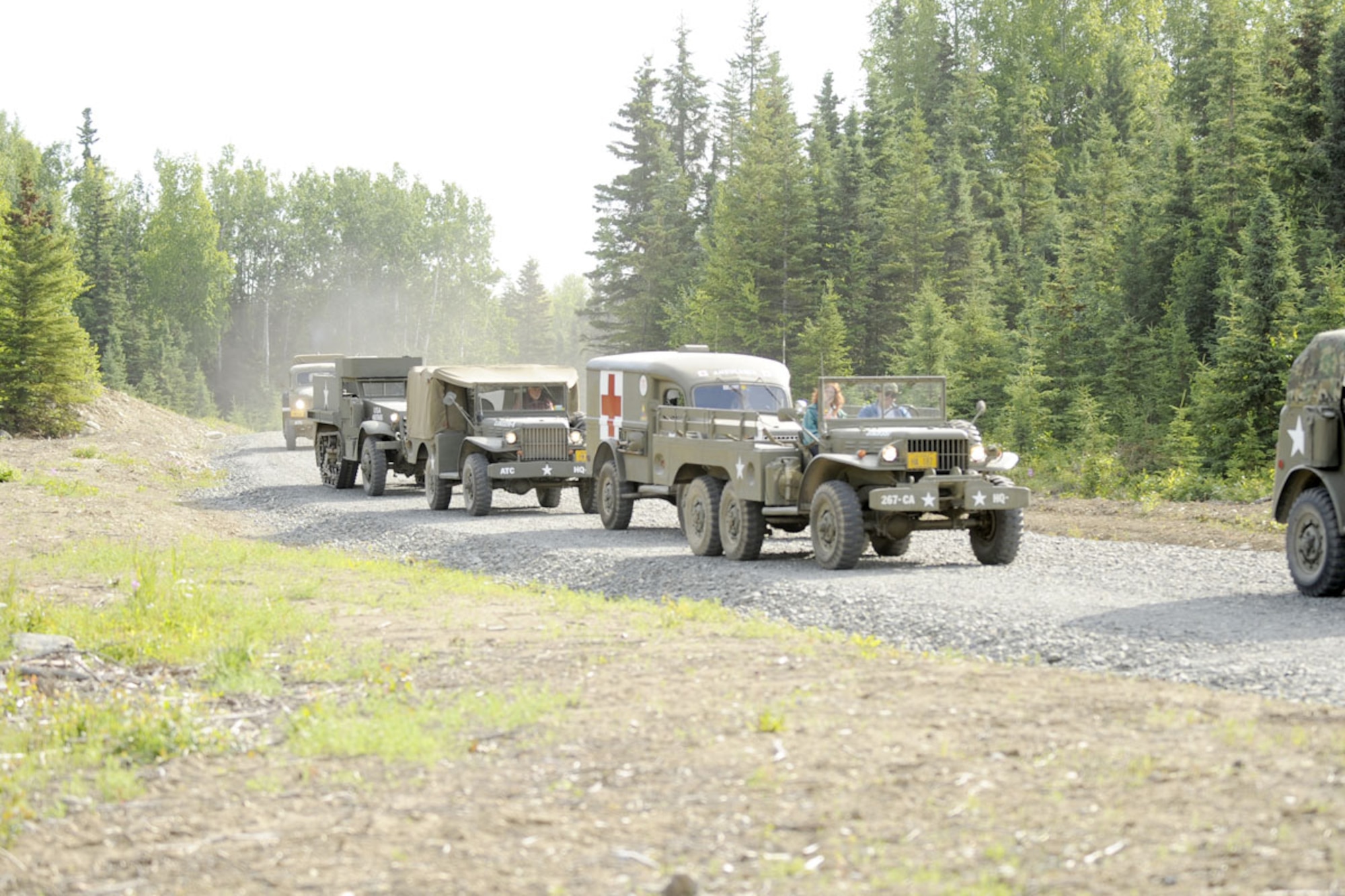 Dave Proehl of the Alaska Territorial Cavalry (Motorized) checks a map before a 12 vehicle club convoy over 29 miles on the back roads of Joint Base Elmendorf-Richardson. Based in Eagle River,  the club restores World War II vehicles to their origional state. Three vehicles including a 1941 M-2 half-track, are club-owned and restored. Many of the approximately 200 members own and operate their own restored military vehicles. They take part in many local events including 4th of July parades and were part of the JBER Military Appreciation Car Show on post this year. (U.S. Air Force photo/Steven White)