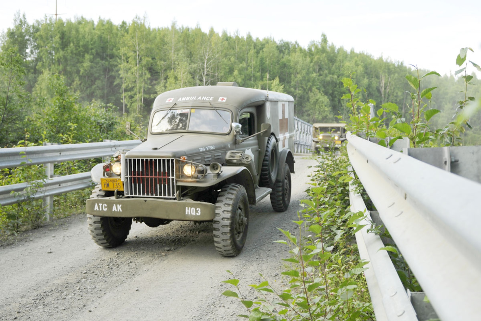 Dave Proehl of the Alaska Territorial Cavalry (Motorized) checks a map before a 12 vehicle club convoy over 29 miles on the back roads of Joint Base Elmendorf-Richardson. Based in Eagle River,  the club restores World War II vehicles to their origional state. Three vehicles including a 1941 M-2 half-track, are club-owned and restored. Many of the approximately 200 members own and operate their own restored military vehicles. They take part in many local events including 4th of July parades and were part of the JBER Military Appreciation Car Show on post this year. (U.S. Air Force photo/Steven White)