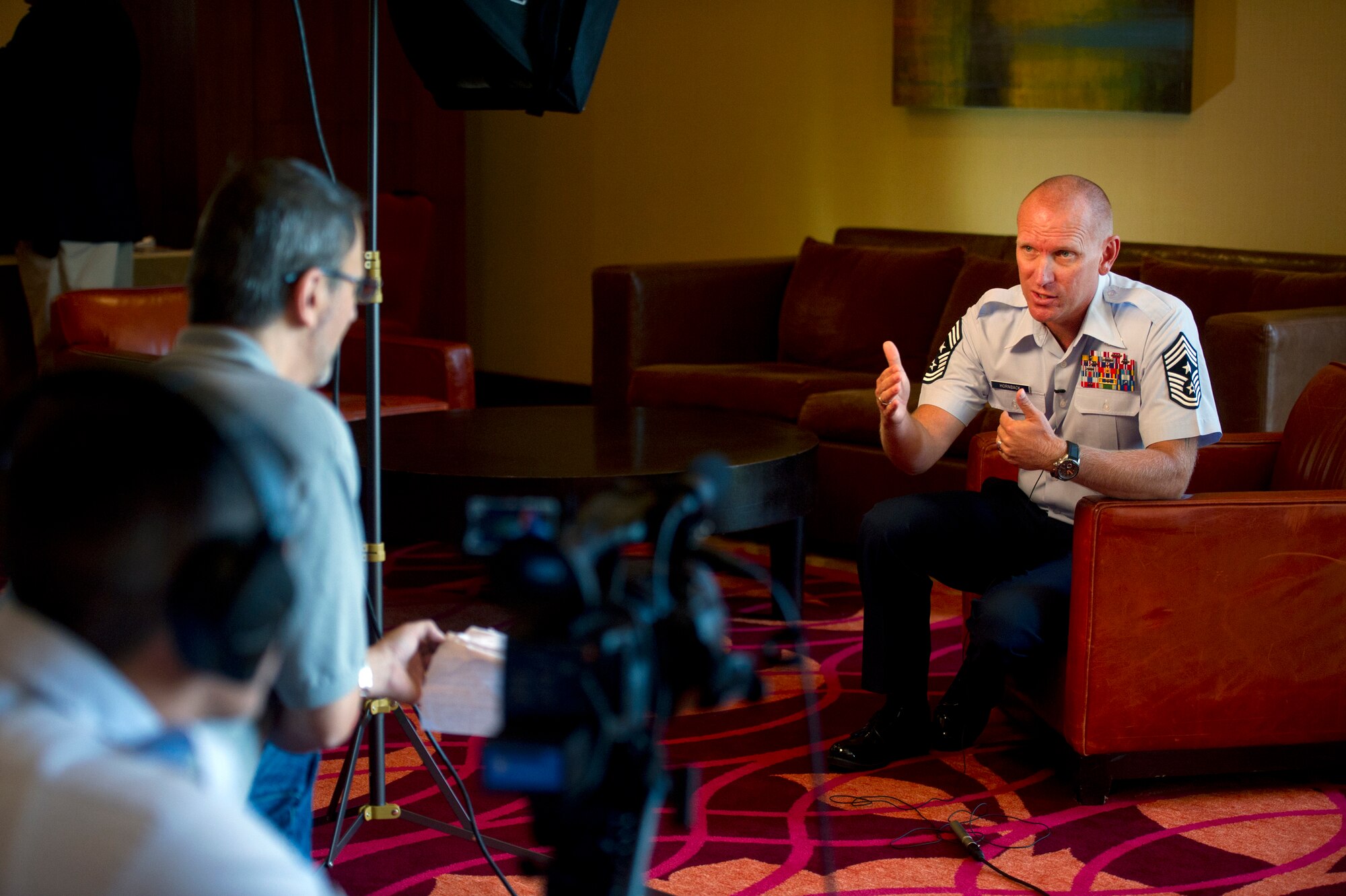 Chief Master Sgt. Brian S. Hornback, the command chief for Air Force Global Strike Command, answers a question during an interview with Steve Ninotta and Senior Airman Anthony Gamez, 3rd Combat Camera Squadron, July 26, 2011, during the Air Force Sergeants Association's Annual Professional Airmen's Conference in San Antonio. (U.S. Air Force photo)