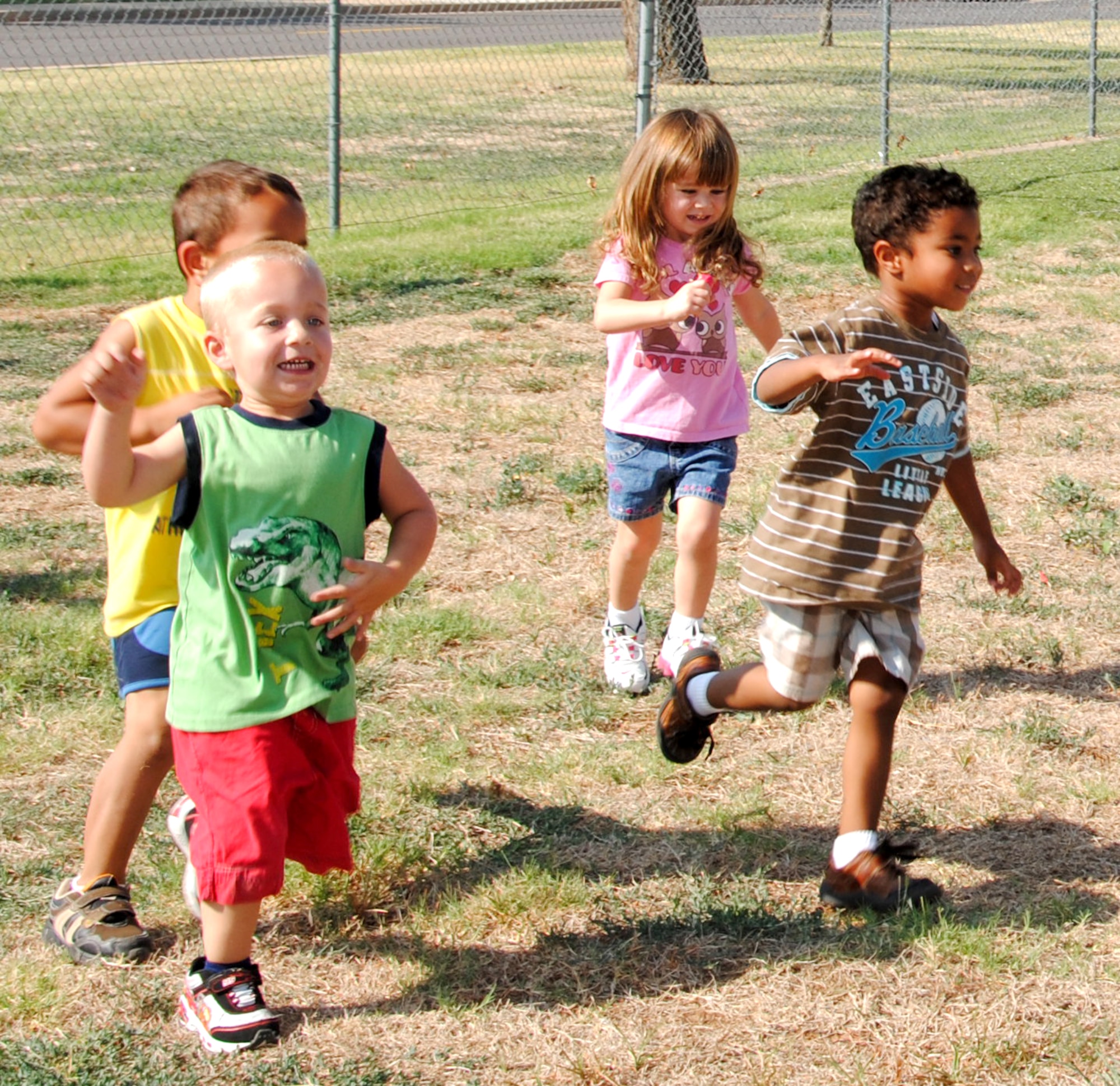 Children at the Vance AFB Child Development Center participate in the “Fit Families” program taught by the staff of the Health and Wellness Center. The program combines healthy eating and exercise, which for the younger participants, means getting outside and having fun. (U.S. Air Force photo/ Jessica Gibson)