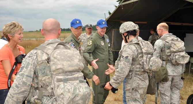 Congratulating members of the Fairchild's Rodeo Team following a security forces tactics exercise are, from left, Mrs. Dawn Hawn, Spokane civic leader; Lt. Col. Brad Hamby, Fairchild Rodeo team chief of the 92nd Air Refueling Squdron; and Col. Marc Van Wert, 92nd Air Refueling Wing commander. The Fairchild 92nd Security Forces Squadron completed their exercise July 25 as part of the Air Mobility Rodeo at Joint Base Lewis-McChord. They have two more security forces exercises before a champion is named at Friday's closing ceremonies. (U.S. Air Force Photo/Tech. Sgt. Jennifer Buzanowski)