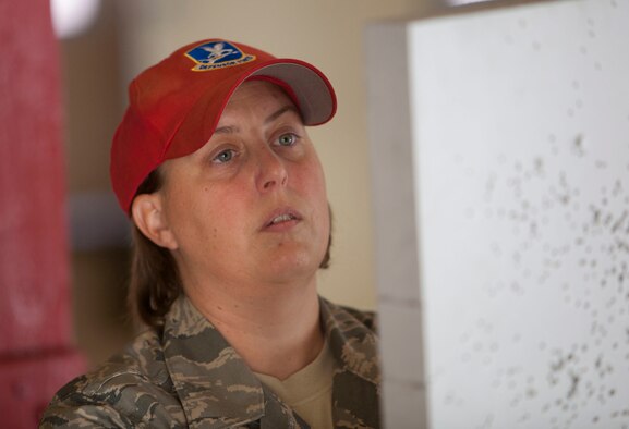 Tech. Sgt. Renae Bounouas prepares targets for students qualifying with M16-A2 rifles July 16, 2011, at the combat arms training and maintenance center Joint Base Andrews, Md. Tech. Sgt. Renae Bounouas is the 113th Security Forces CATM NCO in charge (U.S. Air Force photos/Tech Sgt. Gareth Buckland/Released)