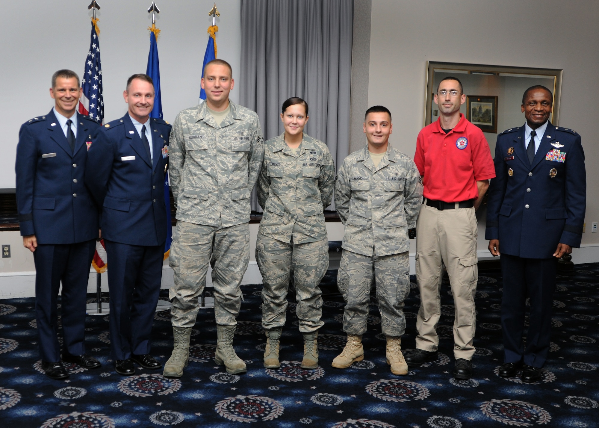 79th Medical Wing Commander Maj. Gen. Gerard Caron, left and Air Force District of Washington Commander Maj. Gen. Darren McDew, right, congratulate the AFDW CBRNE team on earning second place in the Air Force Wide "CBRNE Challenge" held at the Center for National Response in Gallagher W. Va. The Air Force hosts
this annual event to ensure that Air Force Chemical, Biological, Radiological,
Nuclear, and Explosive Response Units maintain full operational capability and
foster a sense of professional rivalry between Major Commands. CBRNE Challenge is
a full scale training event held at the CNR. The training venue provides the
teams with the opportunity to demonstrate how they would respond by using
realistic scenarios, live sources and a variety of training environments not available anywhere else. This year there were ten teams competing from every MAJCOM except PACAF.