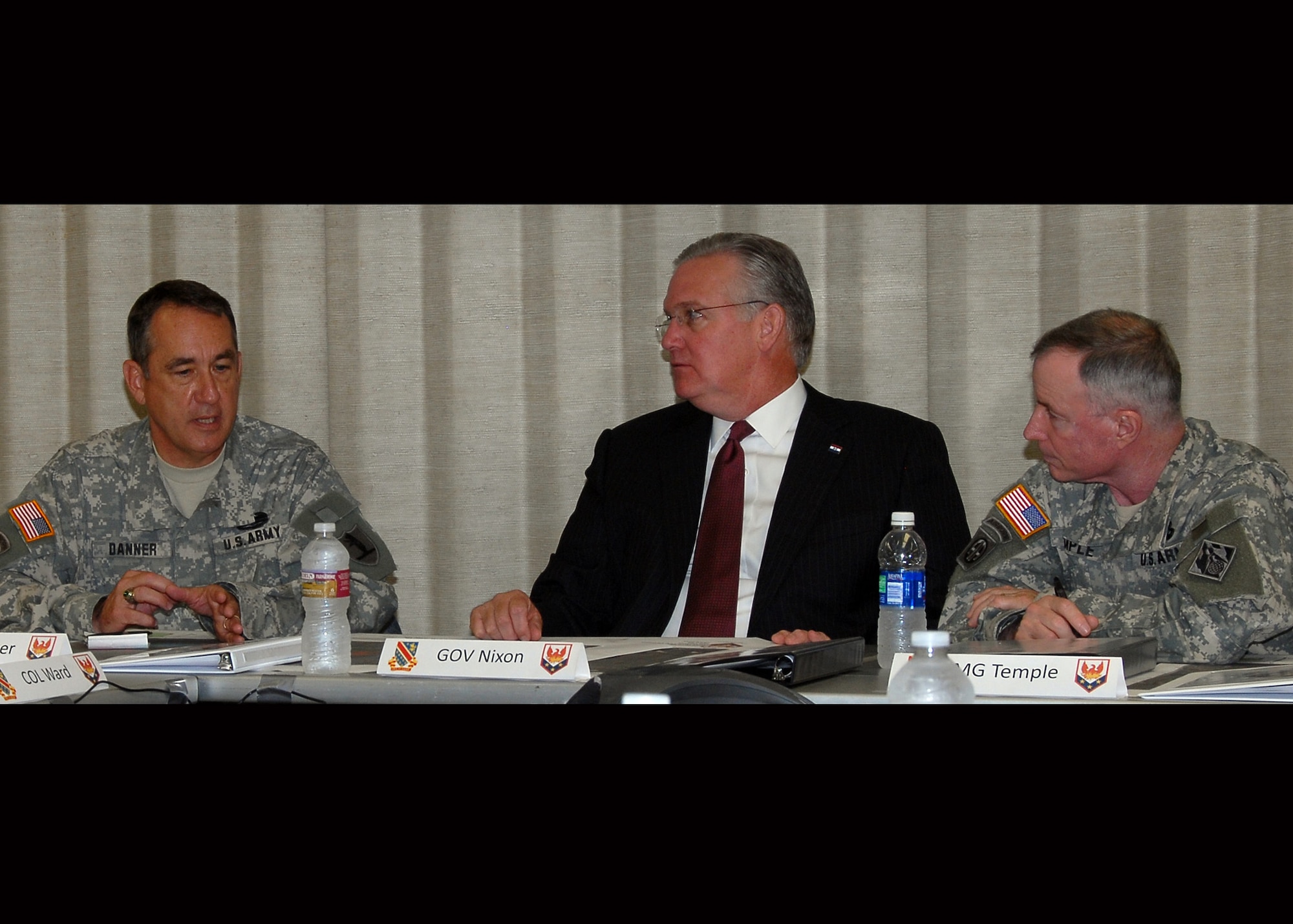 Missouri Governor Jay Nixon, Maj. Gen. Stephen Danner, Commander, Missouir National Guard, and Maj. Gen. Meredith Temple, Commader, US Army Corps of Engineers, meet in in Joplin, MO to discuss diisaster recovery efforts fiollowing the May 22nd storm that devastated the city.   (Photo by Technical Sgt. Robert Ayres)