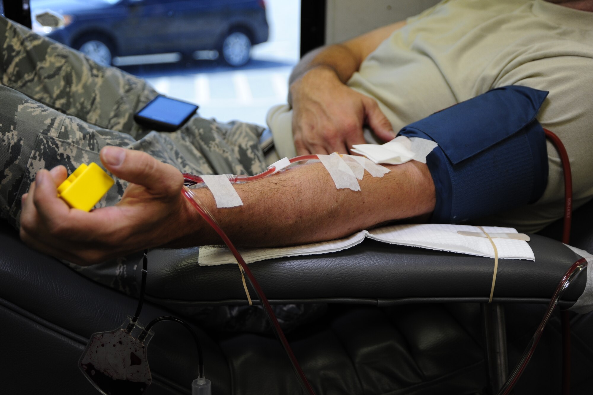 Senior Master Sgt. Adam Wooley, 1st Special Operations Equipment Maintenance Squadron, squeezes a stress block to increase blood flow during a blood drive held at Hurlburt Field, Fla., July 20, 2011.  The 1st Special Operations Medical Group coordinates a blood drive with the NFBS every two months.  (U.S. Air Force Photo by Airman Naomi Griego)