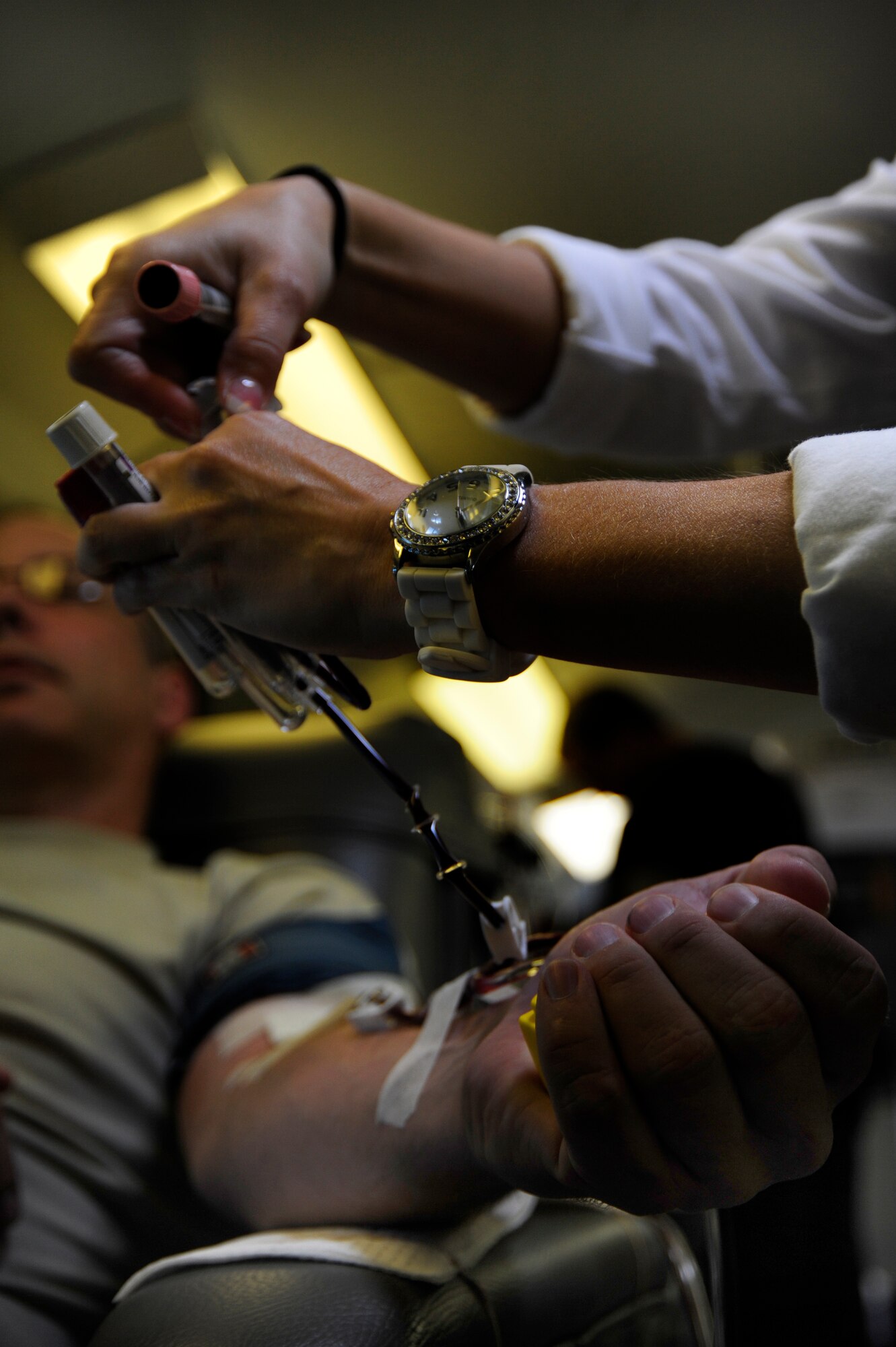 Senior Master Sgt. Adam Wooley, 1st Special Operations Equipment Maintenance Squadron, gets his blood drawn by a Northwest Florida Blood Services technician during a blood drive held at Hurlburt Field, Fla., July 20, 2011. The 1st Special Operations Medical Group coordinates blood drives with the NFBS every two months.  (U.S. Air Force Photo by Airman Naomi Griego)