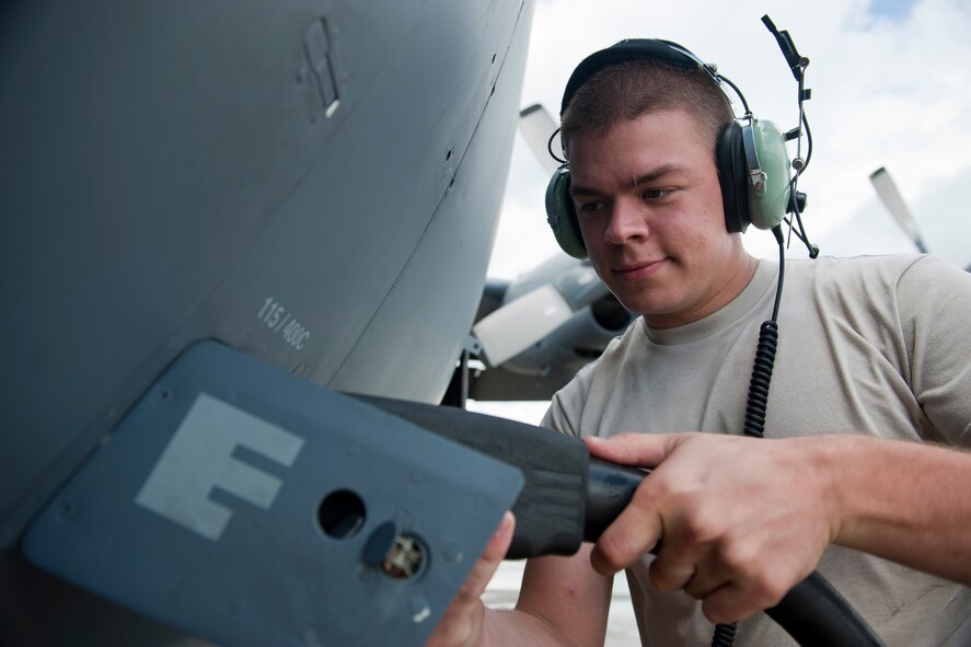 U.S. Air Force Airman 1st Class Anthony Davis, 723rd Aircraft Maintenance Squadron crew chief, connects a generator to an HC-130P Combat King at Moody Air Force Base, Ga., July 27, 2011. The generator provides an external power source needed to conduct maintenance on a powered-down aircraft. (U.S. Air Force photo by Staff Sgt. Jamal D. Sutter/Released)