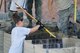 Airmen with the Missouri Air National Guard’s 139th Airlift Wing fill HESCO barriers with sand around a critial building at Rosecrans Air National Guard Base July 27, 2011. The barriers are being erectred as a precationary mesaure should the Missouri River flood the area. (U.S. Air Force photo by Staff Sgt. Michael Crane)