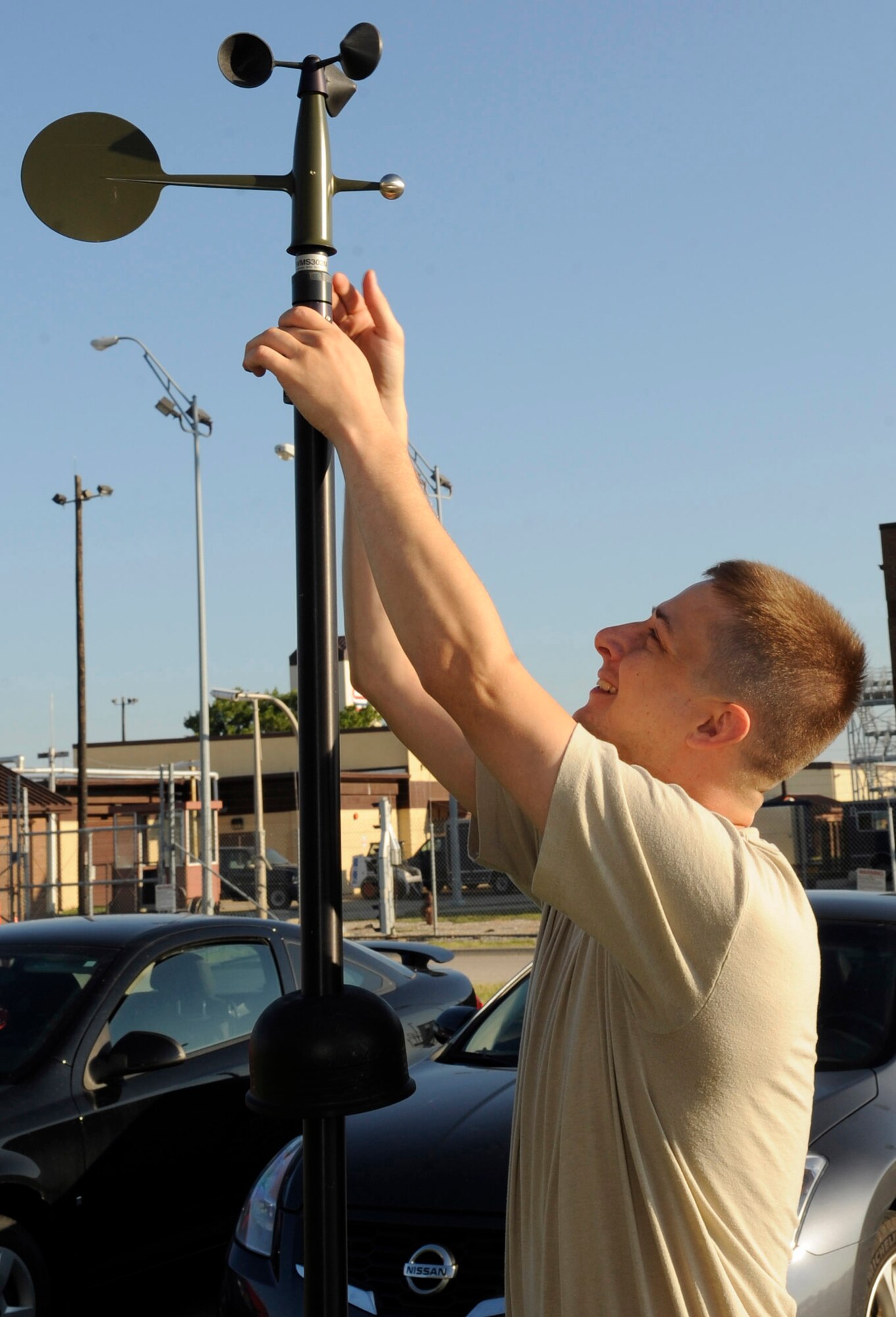 WHITEMAN AIR FORCE BASE, Mo. -- Staff Sgt. Ryan Watts, 509th Operations Support Squadron weather training NCO in charge, sets up the tactical meteorological observing systems to perform routine maintenance here July 20. The suite of automatic tactical weather sensors provides an automated collection of weather elements in deployed environments. (U.S. Air Force photo by Senior Airman Alexandra M. Boutte) (RELEASED)