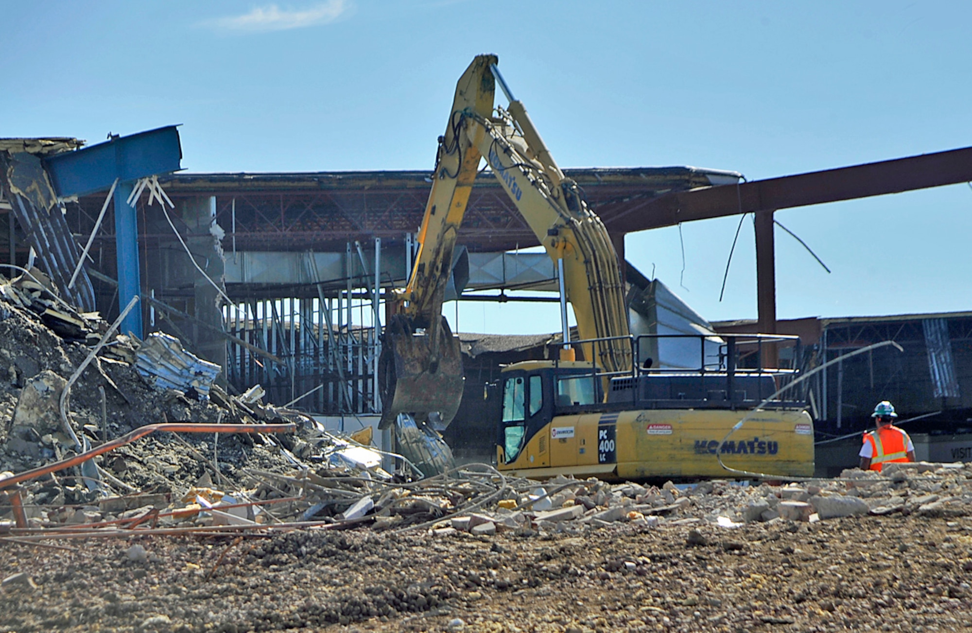 Deconstruction of the old commissary on Stewart Avenue and Otis Street started July 12, 2011. Materials were sorted into three piles; recyclable, reusable and waste. (U.S. Air Force photo/Dennis Howk)