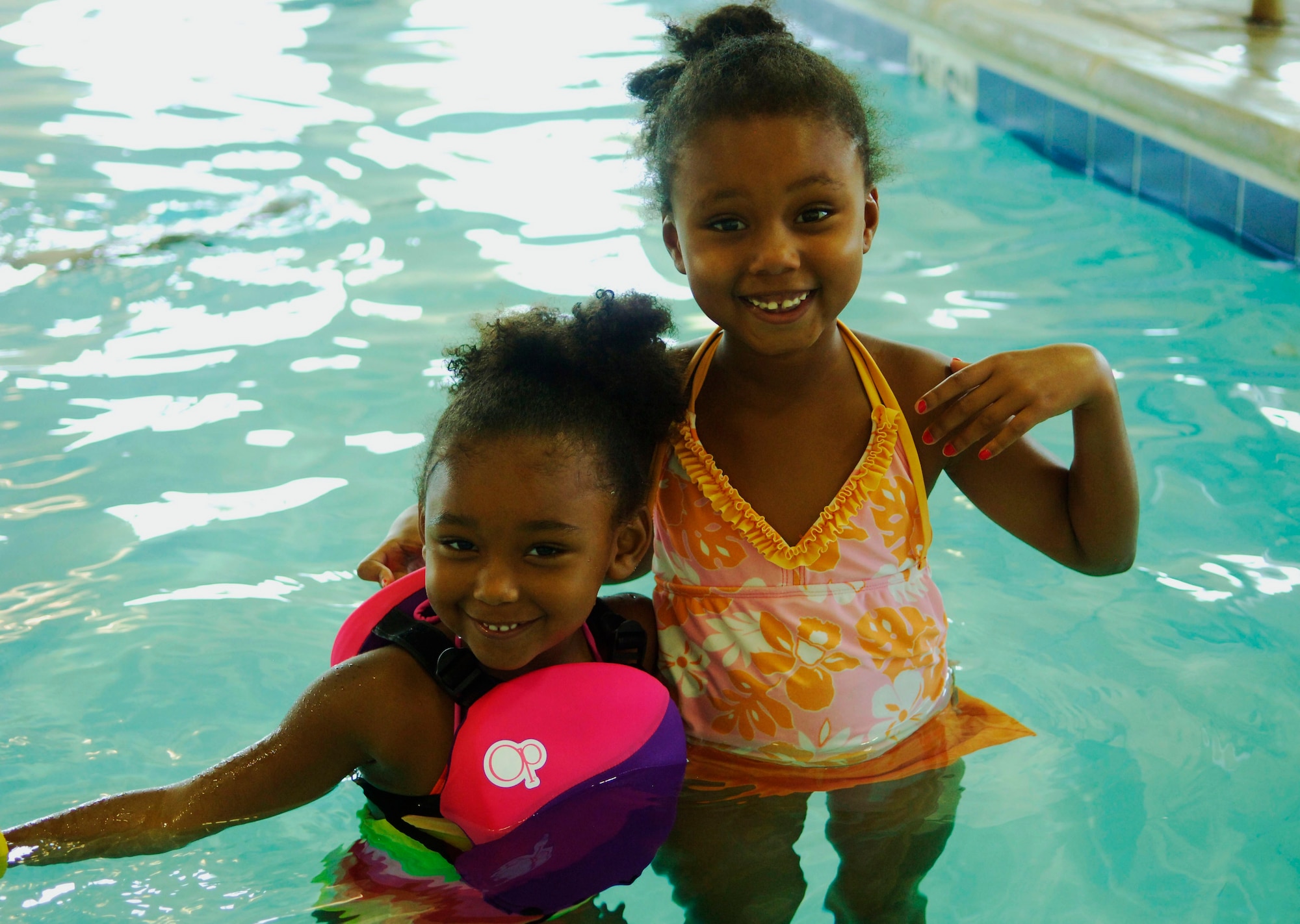 Gabby, 4, and Maya, 6, stay cool in the indoor pool at the Patriots Landing community center July 21, 2011. (U.S. Air Force photo/ Samantha Crane)