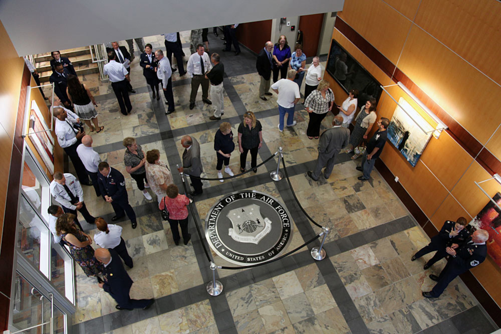 Employees and guests mingle in the foyer of the new Headquarters Air Reserve Personnel Center at Buckley Air Force Base, Colo. ARPC will begin operations in the $17 million, 80,000 square foot facility on Aug. 1. The new personnel center is the first large-scale green facility in Air Force Reserve Command. (U.S. Air Force photo/Quinn Jacobson) 