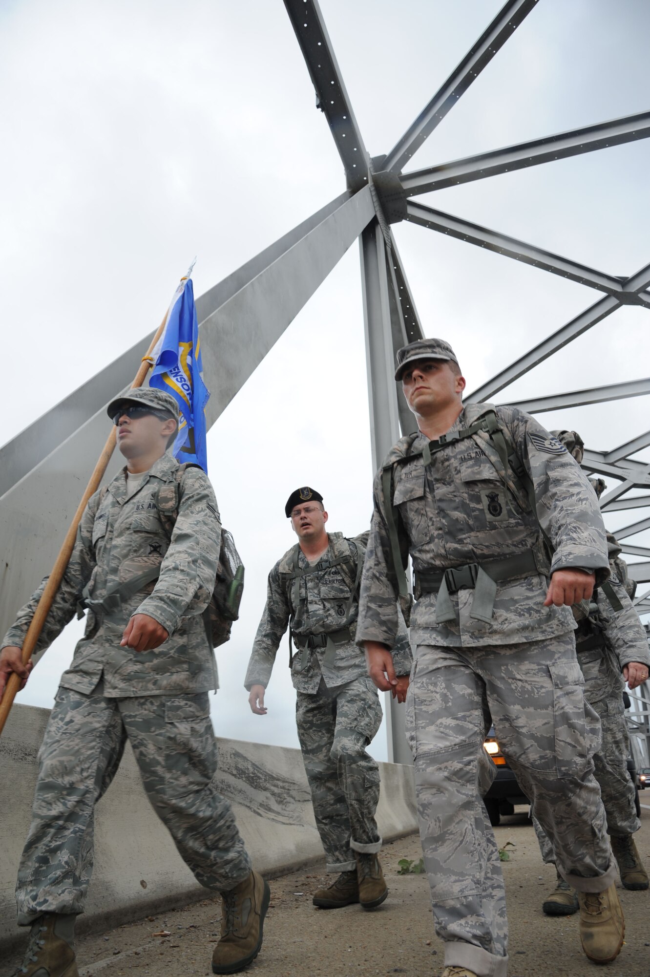 Members of the 14th Security Forces Squadron from Columbus Air Force Base, Miss., volunteering for the “Ruck March to Remember,” march across the Vidalia-Natchez Bridge heading east over the Mississippi River July 26. Team One marched 87 miles of the 146 mile leg assigned to the 14th SFS. (U.S. Air Force photo/Airman 1st Class Chase Hedrick)
