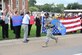 Senior Airman Chris Jones runs by a group of supporters July 26, 2011, in Vidalia, La. during their leg of the “Ruck March to Remember.” Support during the trip came from the community, local businesses and many police stations. (U.S. Air Force photo/Airman 1st Class Chase Hedrick)