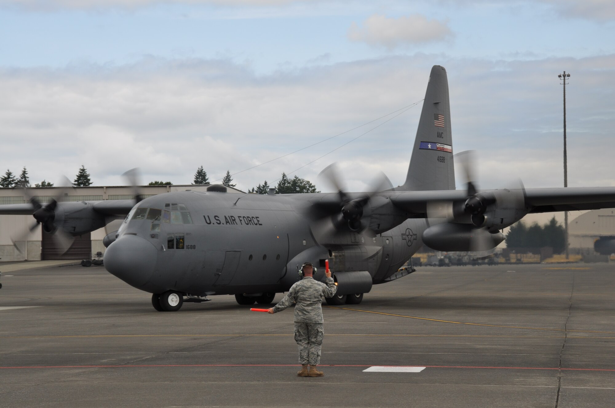 A C-130 Hercules from Dyess Air Force Base prepares for a mission July 26, 2011 during the Air Mobility Rodeo 2011 at Joint Base Lewis-McChord. Air Mobility Rodeo 2011 is a biennial international competition that focuses on mission readiness, featuring airdrops, aerial refueling and other events that showcase the skills of mobility crews from around the world. (U.S. Air Force photo/Airman 1st Class Michael Battles)