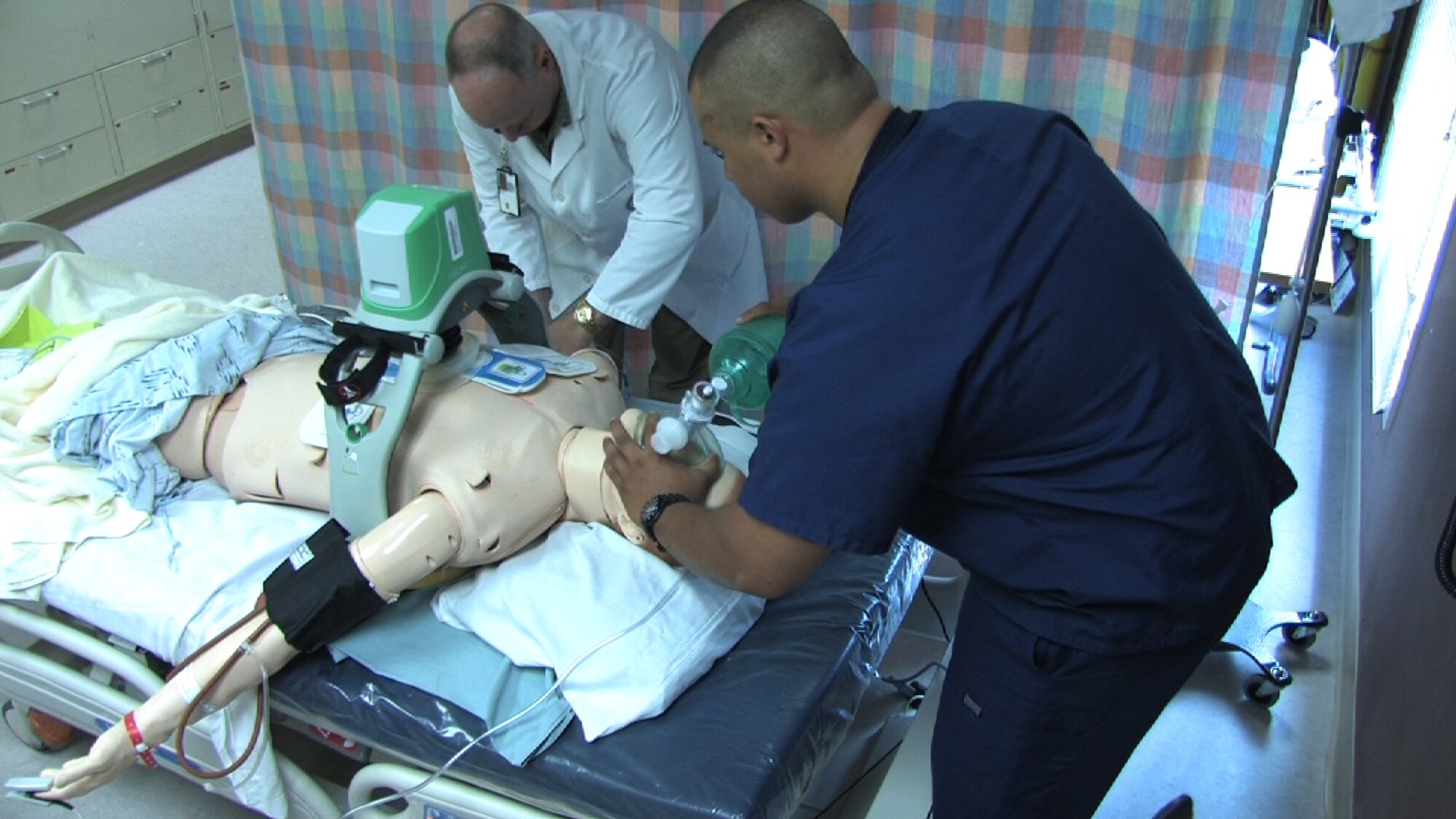 934th Aeromedical Staging Squadron technicians Senior Airmen Stephanie Ward and Angel Rivera perform code blue training at the Minneapolis VA health Care System Simulation Center July 25. Air Force Photo/Wendy Cormier