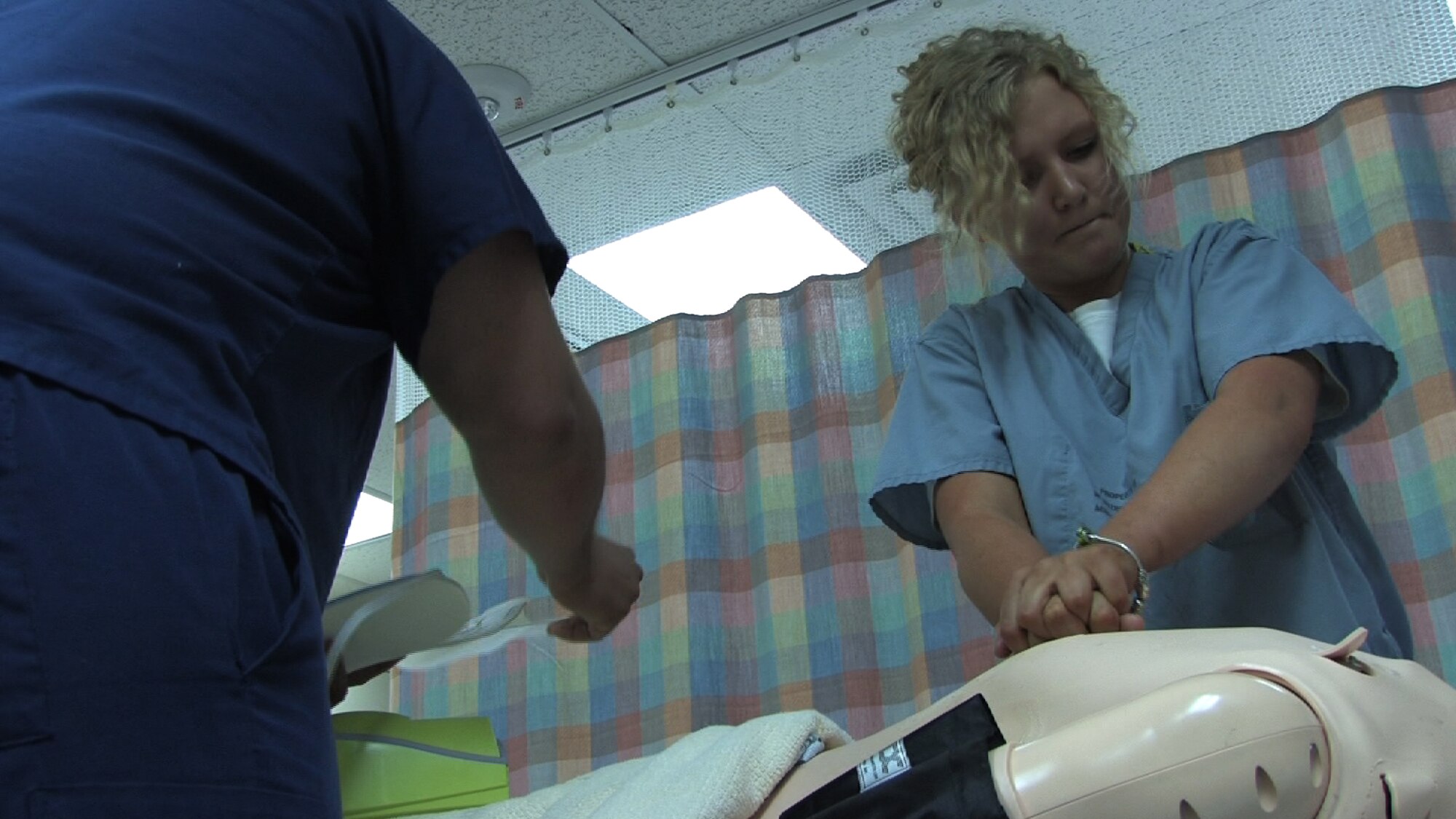 934th Aeromedical Staging Squadron technicians Senior Airmen Stephanie Ward and Angel Rivera perform code blue training at the Minneapolis VA health Care System Simulation Center July 25. Air Force Photo/Wendy Cormier