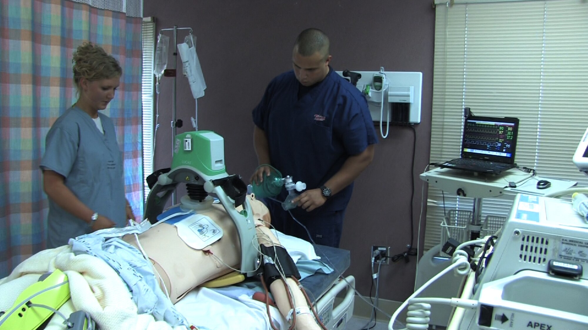 934th Aeromedical Staging Squadron technicians Senior Airmen Stephanie Ward and Angel Rivera perform code blue training at the Minneapolis VA health Care System Simulation Center July 25. Air Force Photo/Wendy Cormier