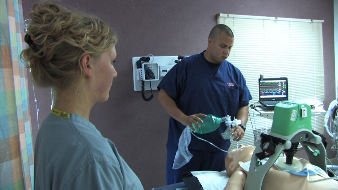 934th Aeromedical Staging Squadron technicians Senior Airmen Stephanie Ward and Angel Rivera perform code blue training at the Minneapolis VA health Care System Simulation Center July 25. Air Force Photo/Wendy Cormier