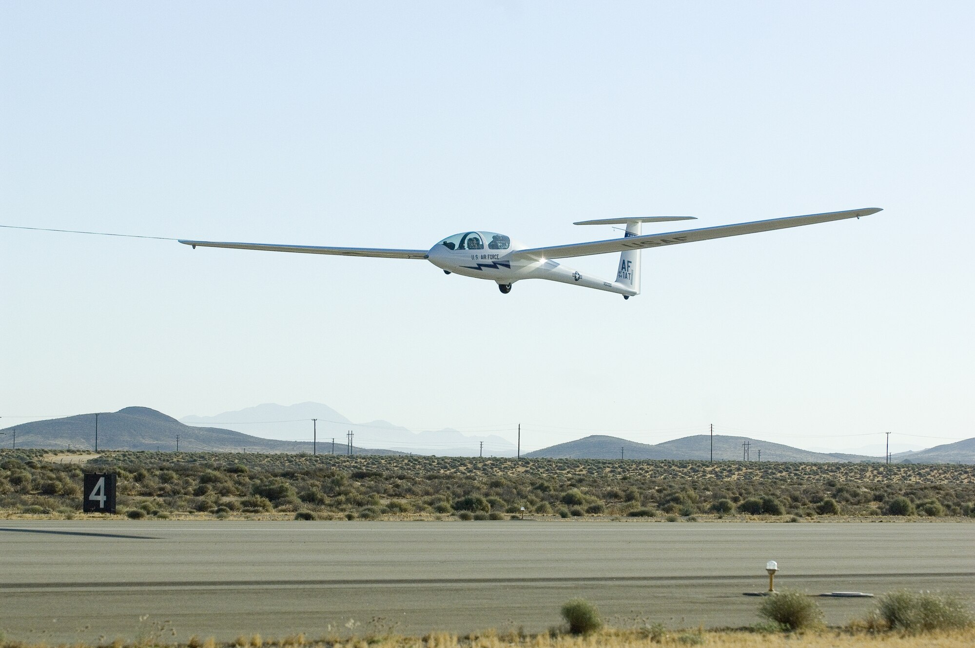 A TG-16A glider takes off from Edwards North Base to conduct a flight test July 6. The Air Force Academy purchased 19 new gliders this month to replace aging gliders. The 445th Flight Test Squadron tested one of the gliders to ensure it meets the needs of the academy. (Air Force photo by Rob Densmore)