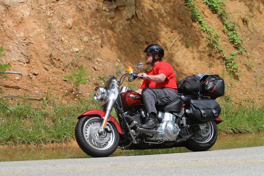 Ray Schlegel, Tunnel 9's senior electronics technician, rounds a curve on his Harley Davidson Fatboy along the roadway known as the "Tail of the Dragon" at Deals Gap, N.C. The photo was taken during a 3,000-mile trek Schlegel took with other members of the Old Glory Harley-Davidson HOG Chapter. (Photo provided)