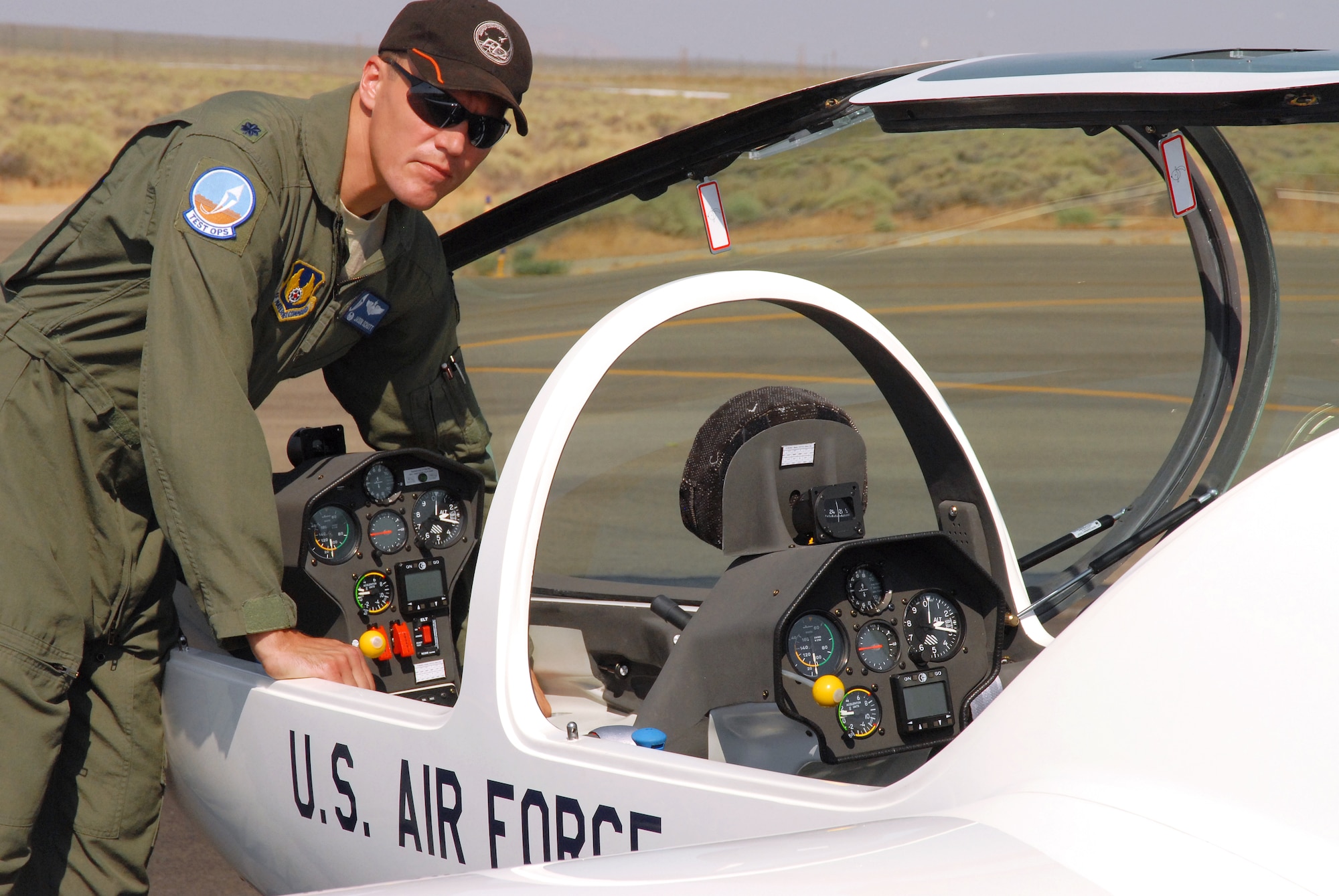 Lt. Col. Jason Schott, 445th Flight Test Squadron commander and Test Operations Combined Test Force director, makes final checks before taking off in a TG-16A glider. The Air Force Academy purchased 19 new gliders this month to replace its aging fleet. The 445th FLTS tested one of the gliders to ensure it meets the needs of the academy. (Air Force photo by Kenji Thuloweit)