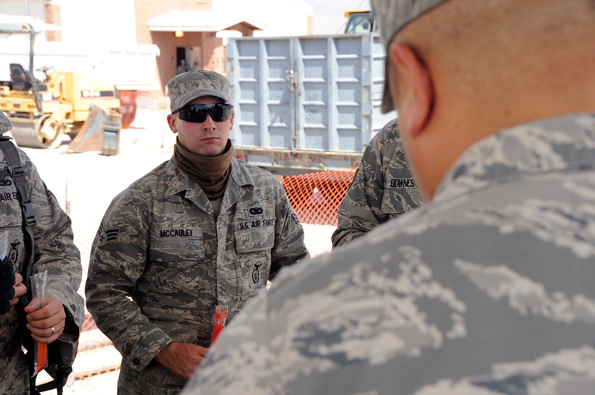 CREECH AIR FORCE BASE, Nev. -- U.S. Air Force Senior Airman Collin McCauley, 916th Security Forces Squadron member from Seymour-Johnson Air Force Base, N.C., engages in conversation with a Creech AFB chaplain July 19 at the 99th Ground Combat Training Squadron training range. The chaplains visited Airmen in the 100-plus degree heat of the Nevada desert to improve morale and learn about the SFS training. (Photo by 432d Wing/432d Air Expeditionary Wing Public Affairs/Released)