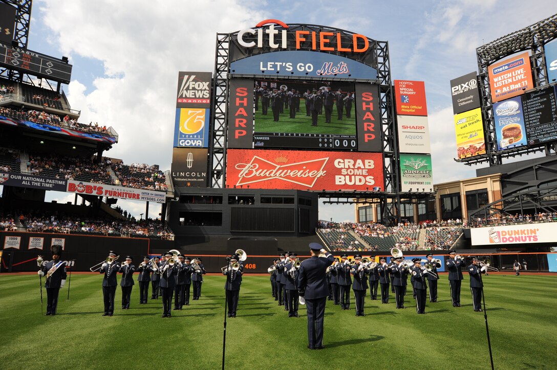 Col. A. Phillip Waite conducts The United States Air Force Ceremonial Brass as they play the National Anthem for the New York Mets vs. New York Yankees baseball game at Citi Field in Flushing, NY, July 2.  (Photo by SrA Christopher Ruano)