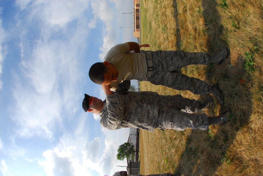 Led by Master Sgt Marvin DiPilato, 914th Security Forces training manager, Airmen from the 914th Security Forces Squadron instructs security forces augmentees on handcuffing techniques during the 914th Airlift Wing Unit Training Assembly July 22, 2011 Niagara Falls Air Reserve Station NY. The augmentees assist Military Law Enforcement with many aspects of base security. 