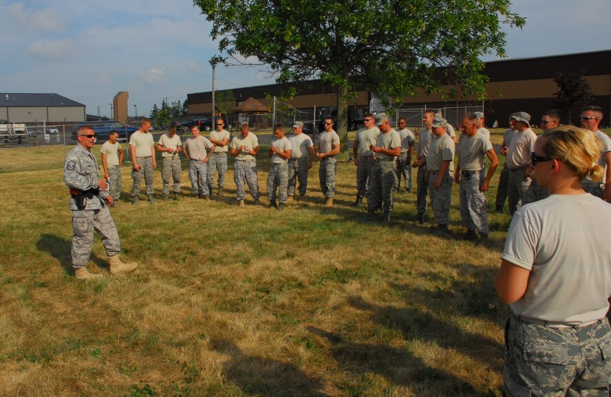 Led by Master Sgt Marvin DiPilato, 914th Security Forces training manager, Airmen from the 914th Security Forces Squadron instructs security forces augmentees on handcuffing techniques during the 914th Airlift Wing Unit Training Assembly July 22, 2011 Niagara Falls Air Reserve Station NY. The augmentees assist Military Law Enforcement with many aspects of base security. 