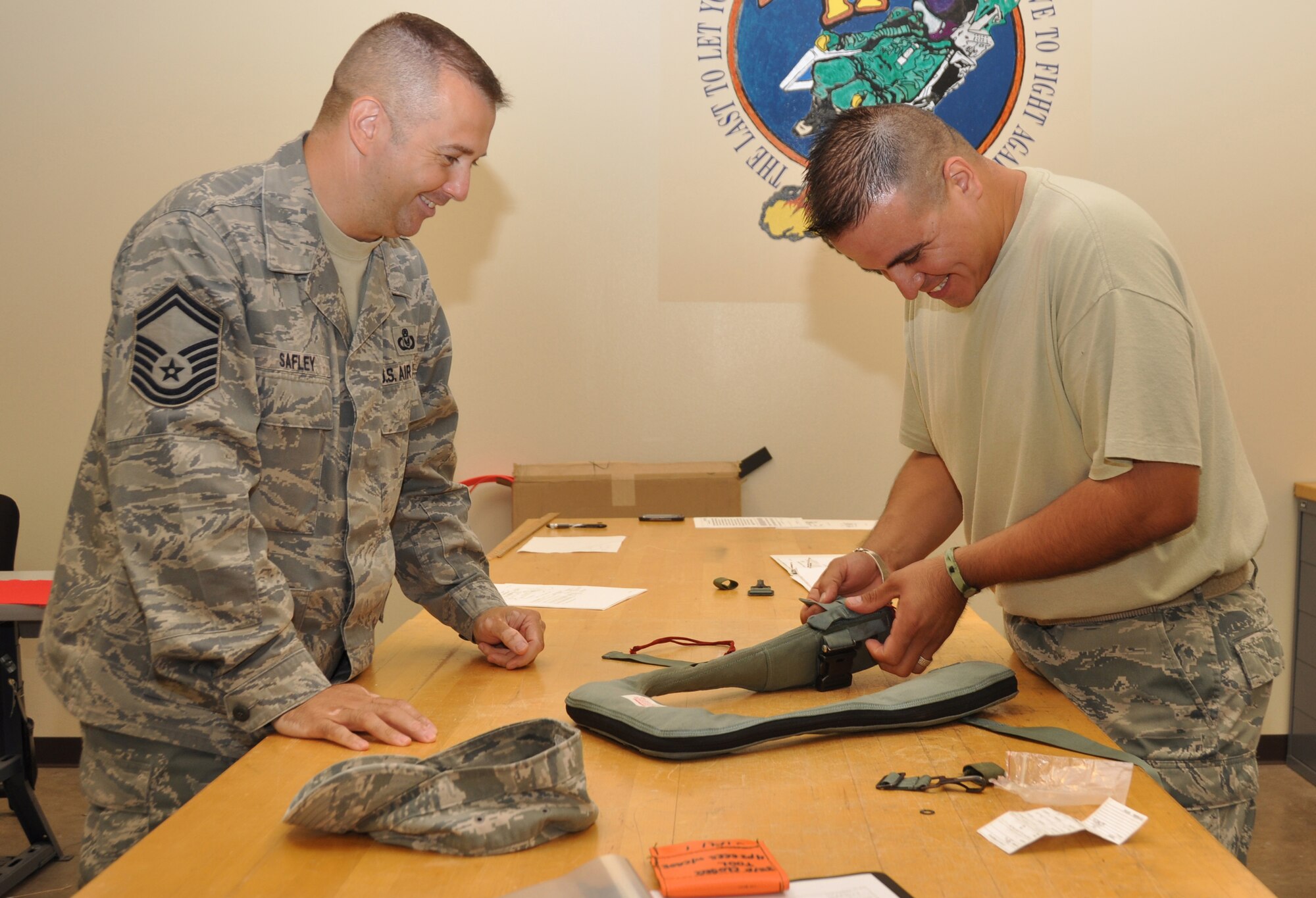 Senior Master Sgt. Rob Safley, left, and Staff Sgt. Roy Pena, complete an annual inspection on an LPU-38P life preserver. Safley is the superintendent of the 301st Operations Support Flight's Aircrew Flight Equipment section and was named the 2010 Outstanding Air Reserve Component Aircrew Flight Equipment Senior Noncommissioned Officer of the Year for the Air Force.  Safley supervises 12 Air Force reservists in the section, including Pena, who is the NCOIC of aircrew training.  (U.S. Air Force photo/Lt. Col. David Kurle)