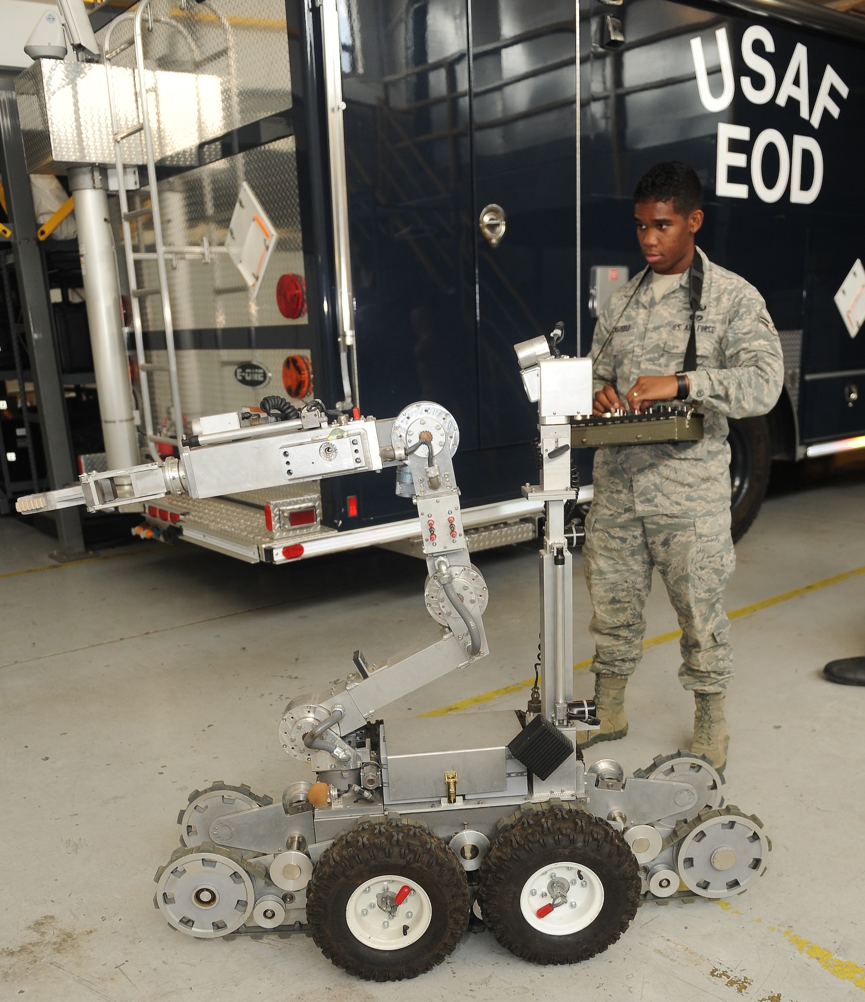 Airman 1st Class Colton Casteele, 633rd Civil Engineer Squadron explosive ordnance disposal apprentice, operates the F6A robot at Langley Air Force Base, Va., July 26, 2011.  The F6A robot is a stateside robot used to clear suspect packages. (U.S. Air Force photo by Staff Sgt. Antoinette Gibson/Released)

