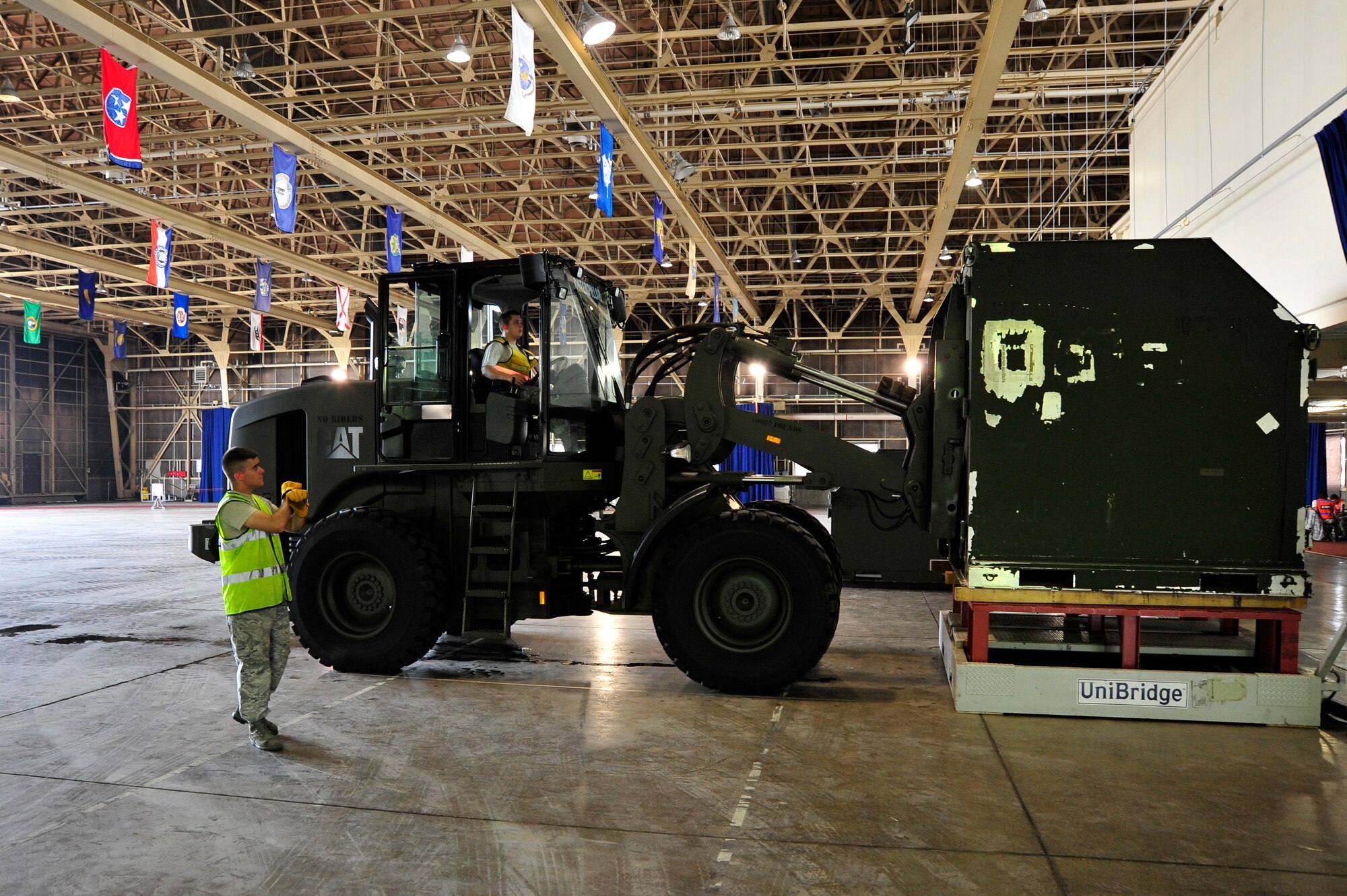 MISAWA AIR BASE, Japan -- Collazo Morles, 35th Logistic Readiness Squadron, marshals a forklift during a training exercise July 27. The exercise gives members of the 35th Fighter Wing a chance to demonstrate the ability to mobilize with little to no notice. (U.S. Air Force photo/Staff Sgt. Nathan Lipscomb/Released)