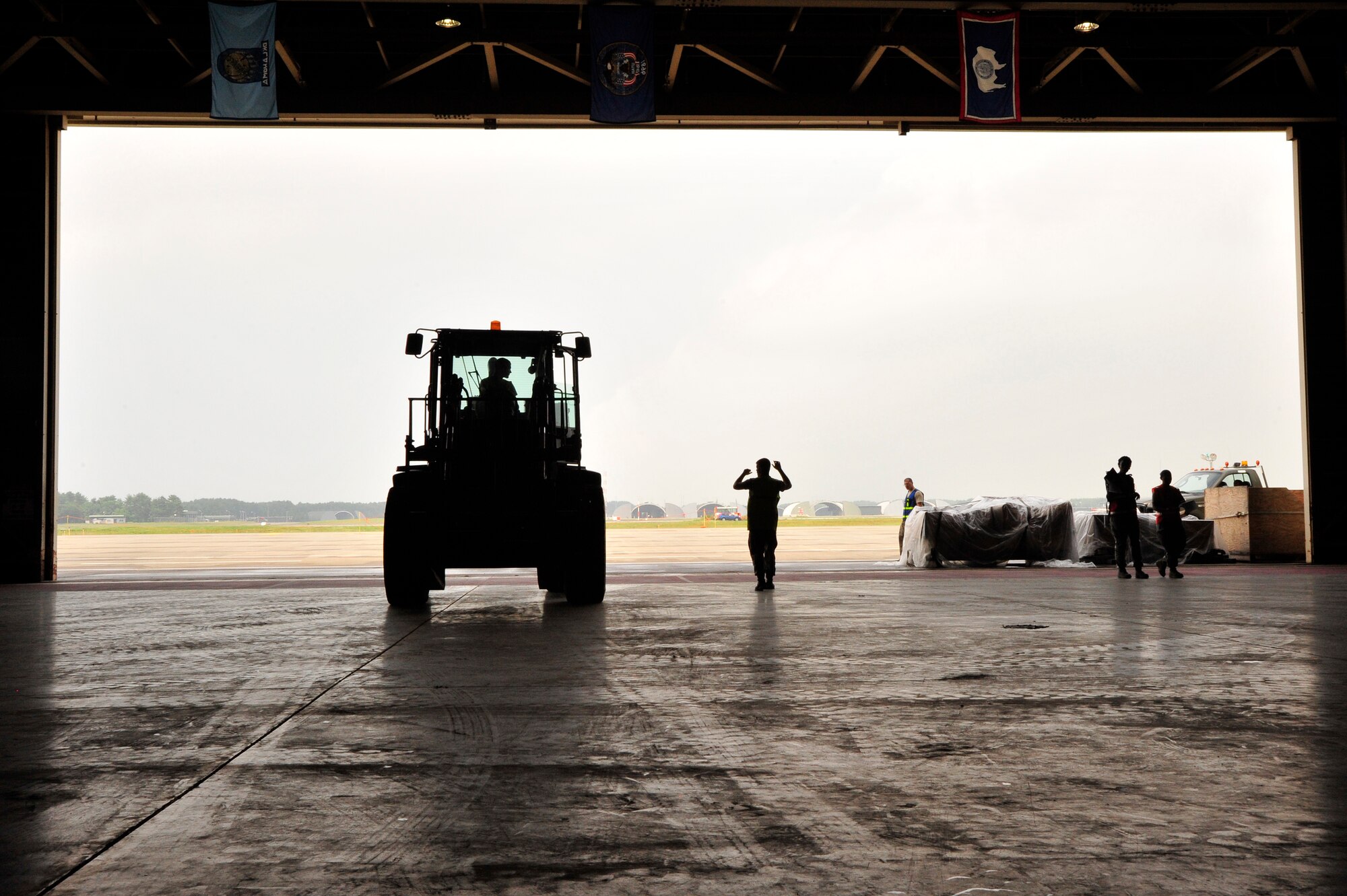 MISAWA AIR BASE, Japan -- Collazo Morles, 35th Logistic Readiness Squadron, marshals a forklift during a training exercise July 27. The exercise gives members of the 35th Fighter Wing a chance to demonstrate the ability to mobilize with little to no notice. (U.S. Air Force photo/Staff Sgt. Nathan Lipscomb/Released)