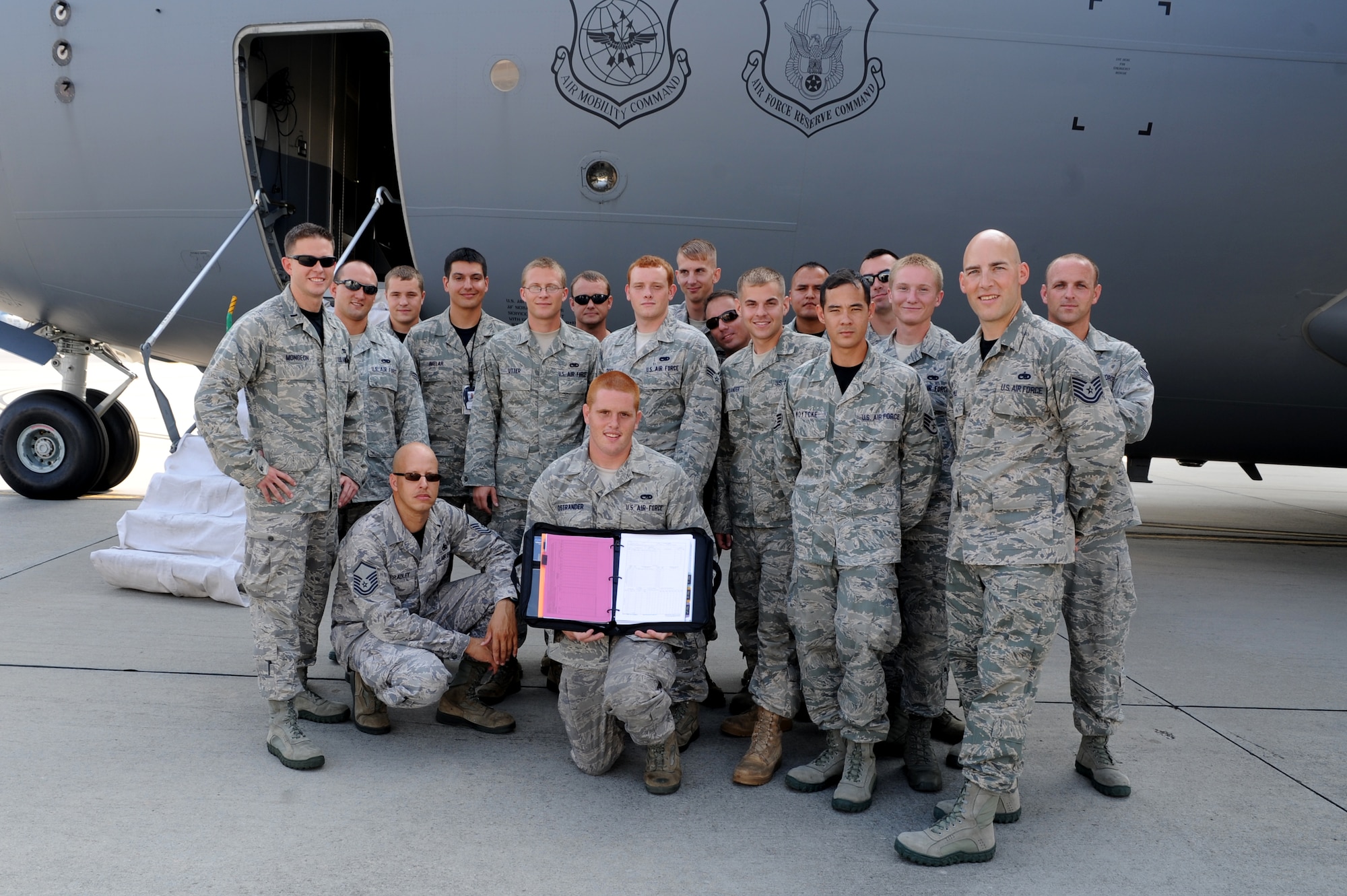 Airmen from the 437th Maintenance Group proudly display their "black letter initial" discrepency report July 22, shortly before the C-17 they worked on departed for Joint Base Lewis-McChord, Wa., for the Air Mobility Command Rodeo 2011. U.S. Air Force photo/Staff Sgt. Nicole Nicole)