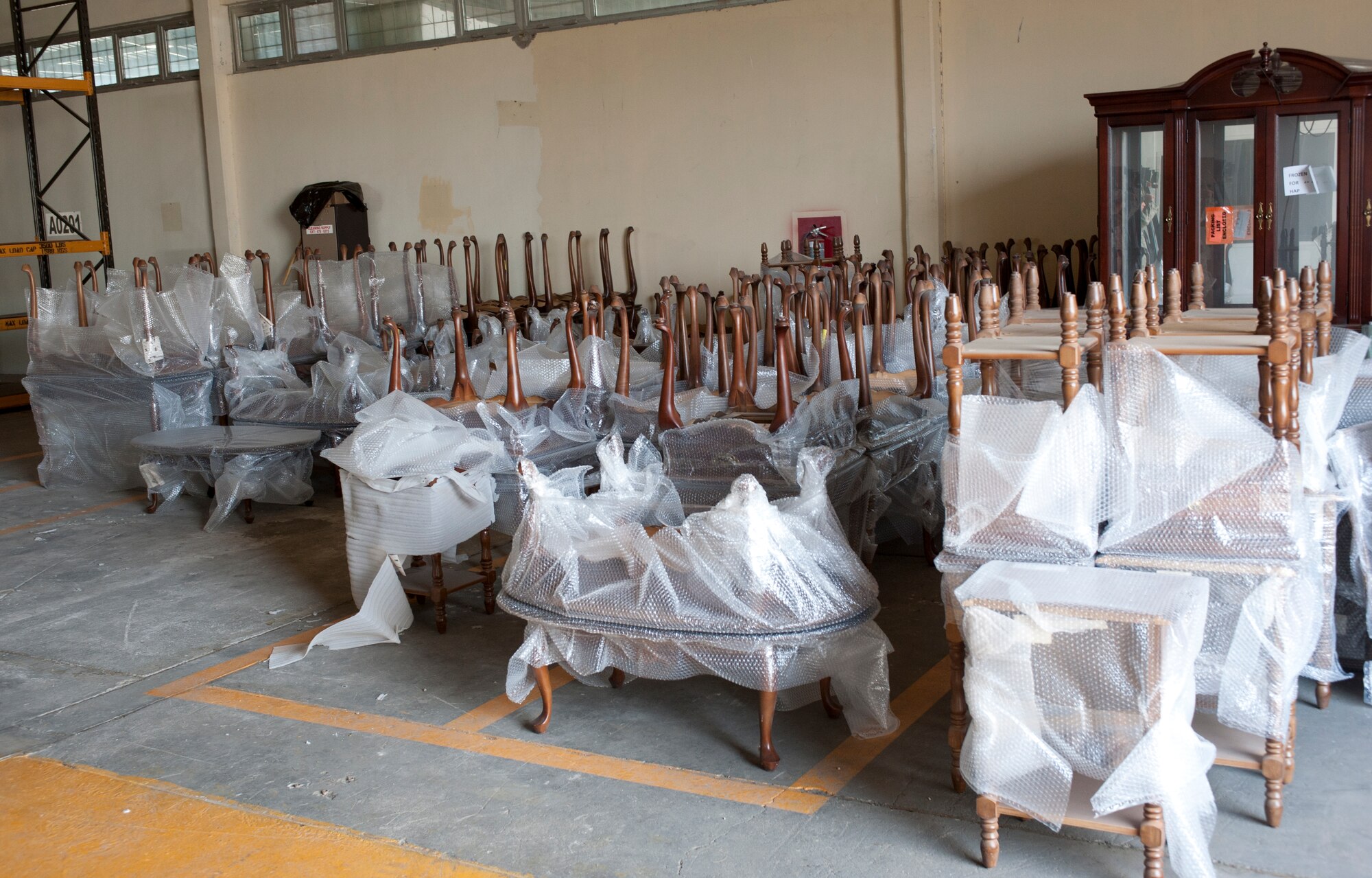 Volunteers from the 39th Air Base Wing prepared furniture for shipment in the Defense Logistics Agency Disposition Services warehouse July 25, 2011, at Incirlik Air Base Turkey. The furniture was issued to the U.S. State Department to be donated to an outpatient clinic in the Republic of Georgia and a school in Azerbaijan. (U.S. Air Force photo by Airman 1st Class Clayton Lenhardt/Released)