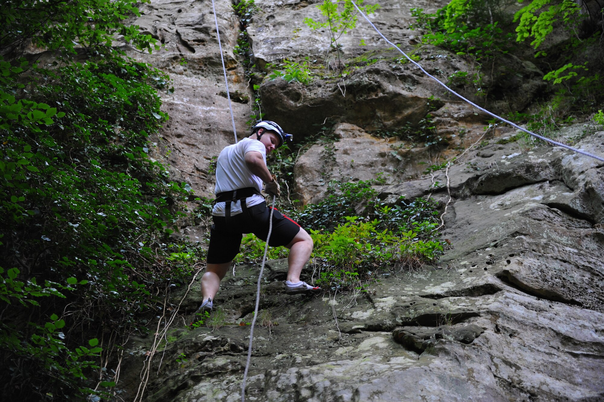 ECHTERNACH, Luxembourg – Airman 1st Class Dillon Davis, 52nd Fighter Wing Public Affairs, rappels down a mountain during a caving and rappelling trip here July 23. Spangdahlem Outdoor Recreation offers caving and rappelling trips annually from April to August for people of all skill levels. (U.S Air Force photo/Airman 1st Class Matthew B. Fredericks)